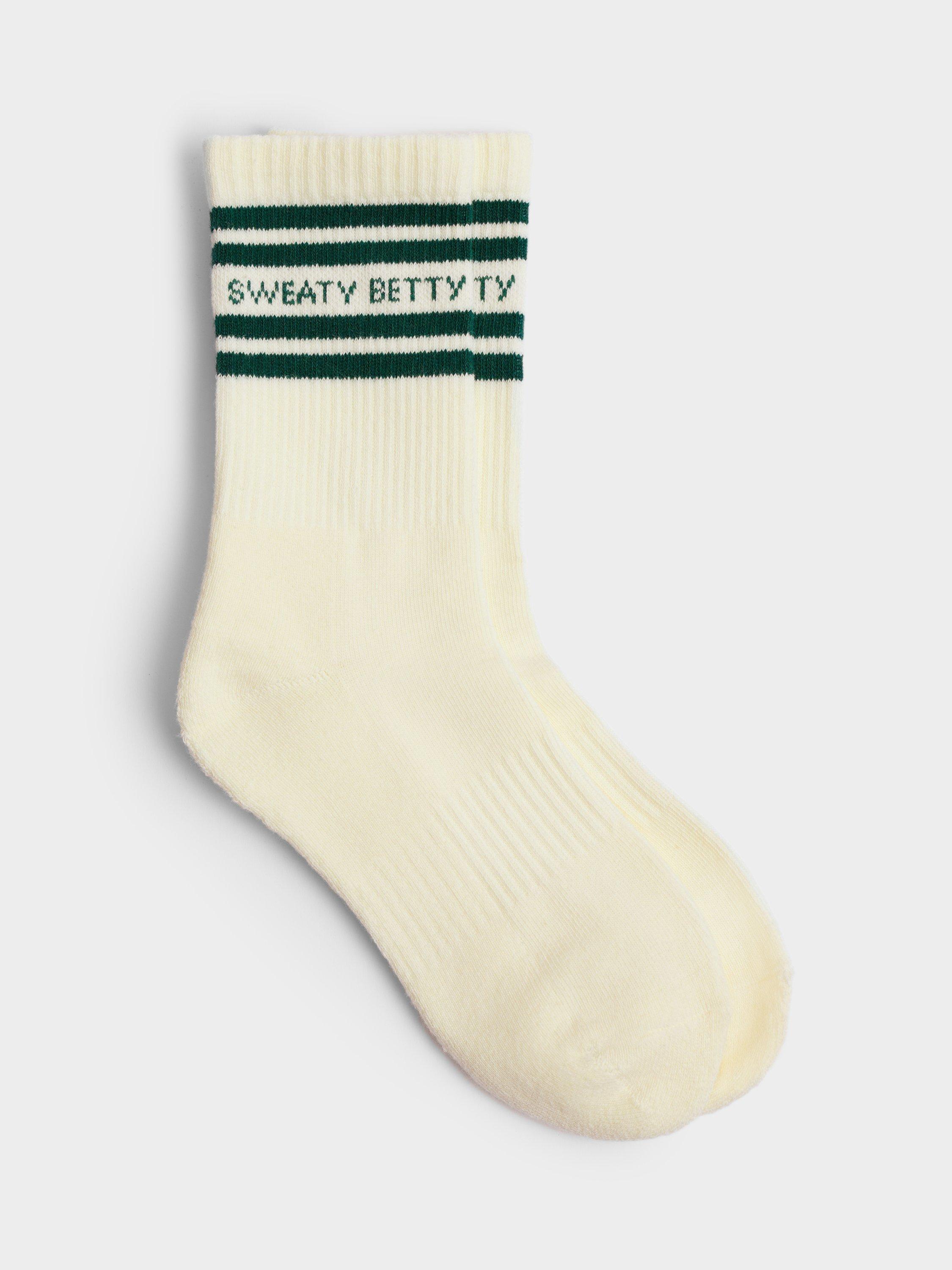 Product image 1 of 2, which shows Sweaty Betty Varsity Slogan Organic Cotton Blend Socks, Cream/Retro Green, 2.5-5