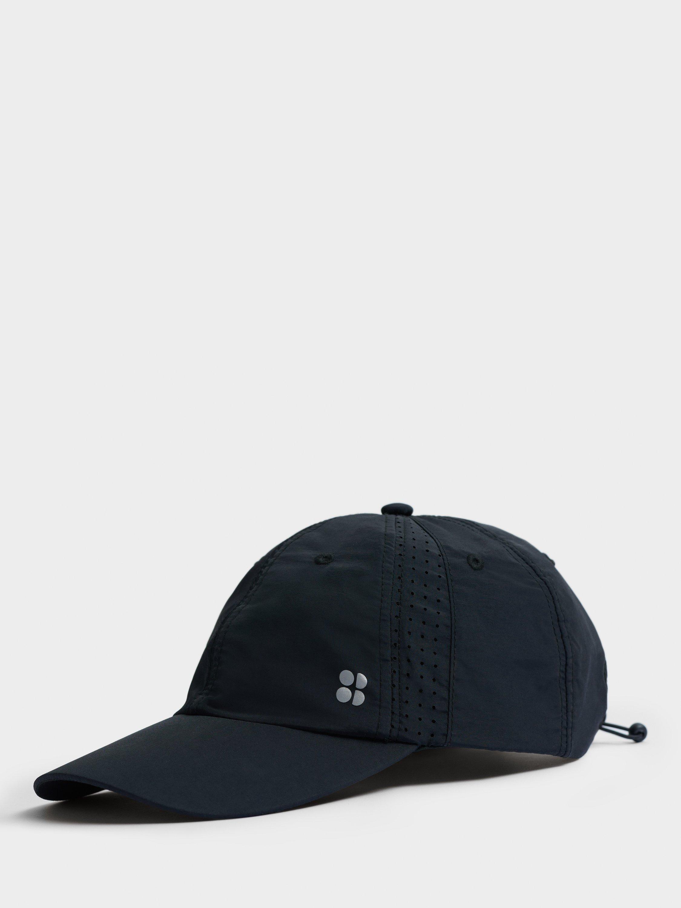 Product image 1 of 4, which shows Sweaty Betty Swiftie Pace Baseball Cap, Black