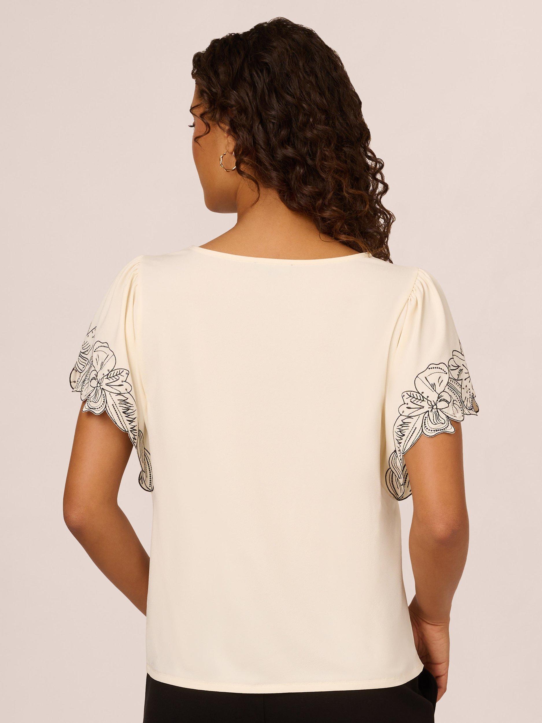 Product image 2 of 7, which shows Adrianna Papell Floral Embroidered Sleeve Top, Cream/Black, XS