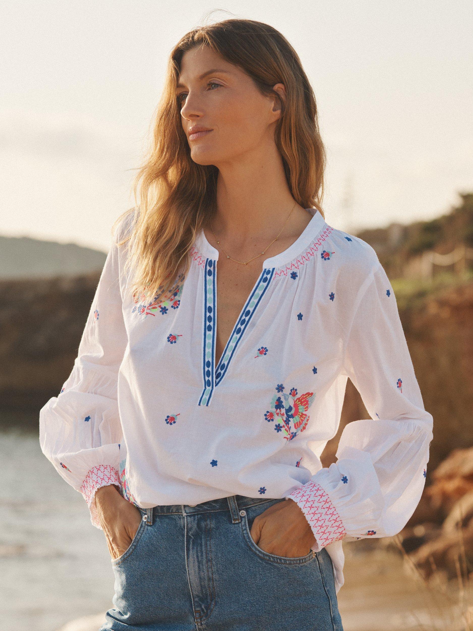 Product image 1 of 10, which shows NRBY Birdie Embroidered Top, White, XS