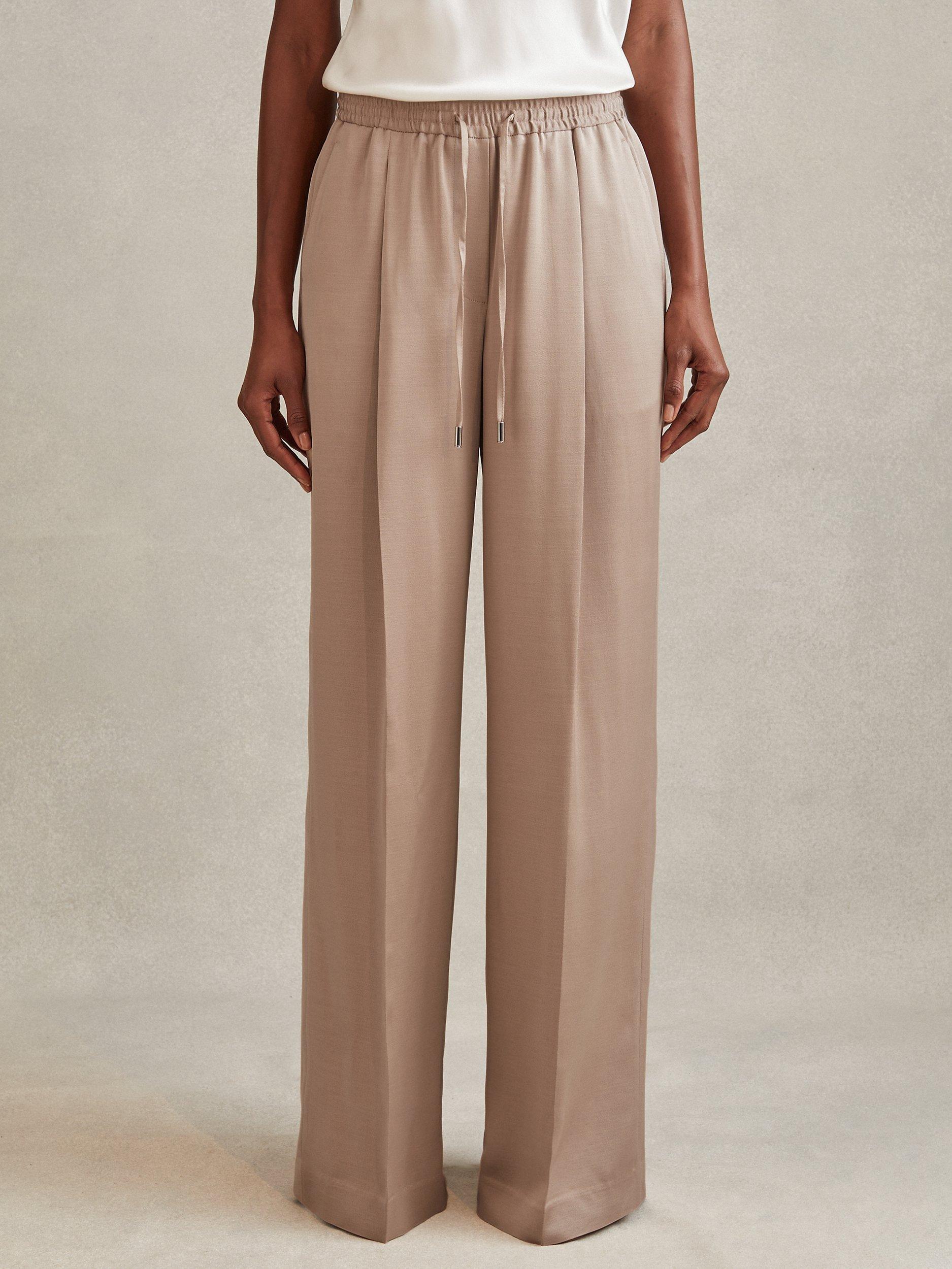 Product image 1 of 4, which shows Reiss Cole Wide Leg Satin Drawstring Suit Trousers, Gold, 10R