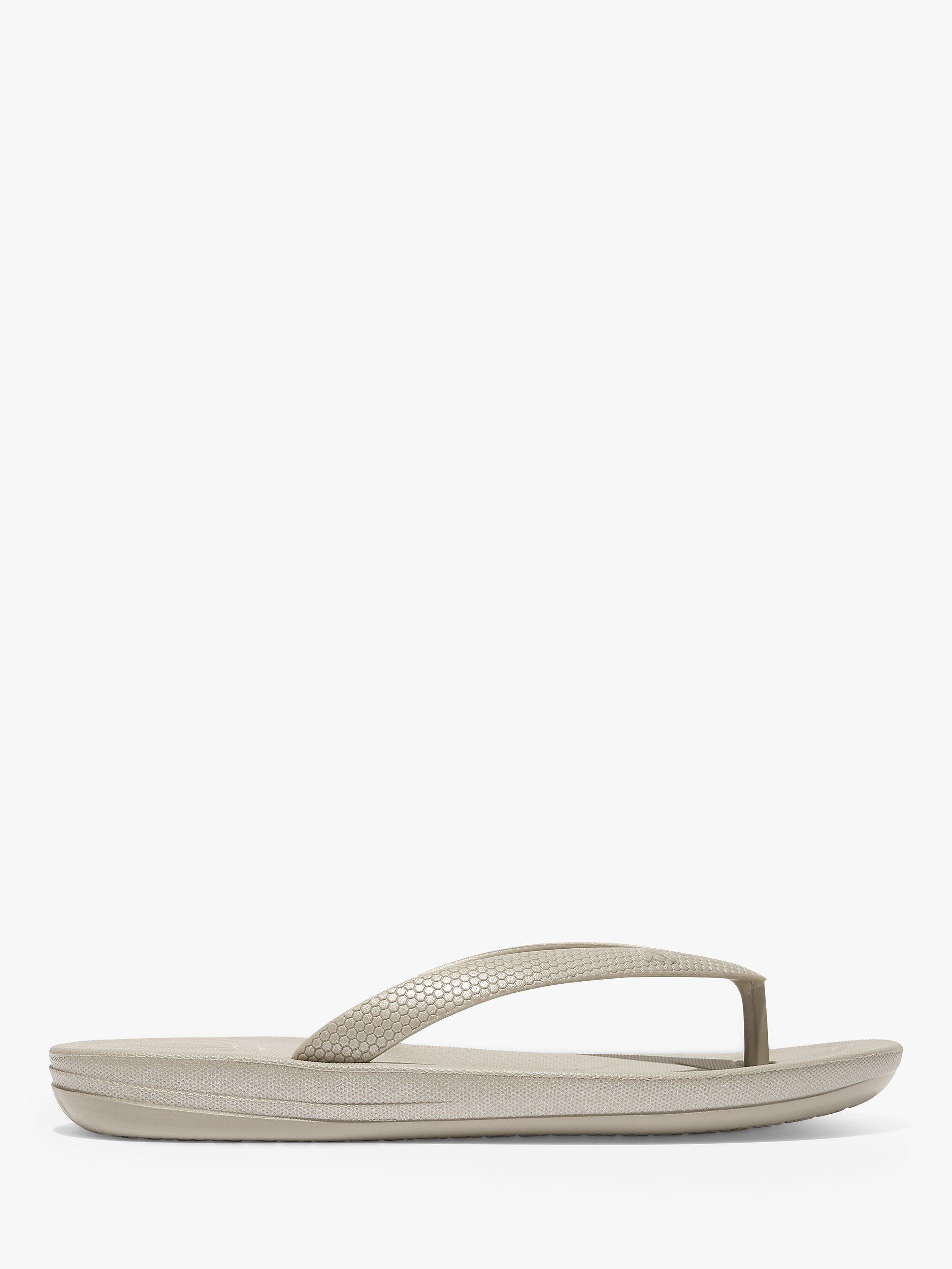 Product image 1 of 4, which shows FitFlop Kids' Iqushion Pearlised Flip Flops, Silver, 1