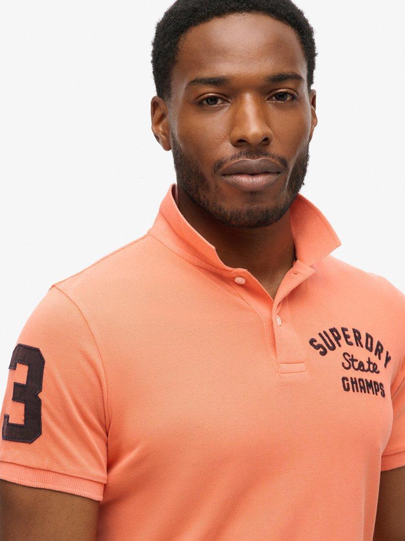 Product image 4 of 6, which shows Superdry Superstate Polo Shirt, Sunburst Coral, S