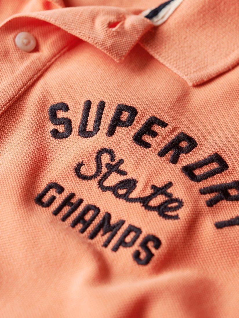 Product image 5 of 6, which shows Superdry Superstate Polo Shirt, Sunburst Coral, S