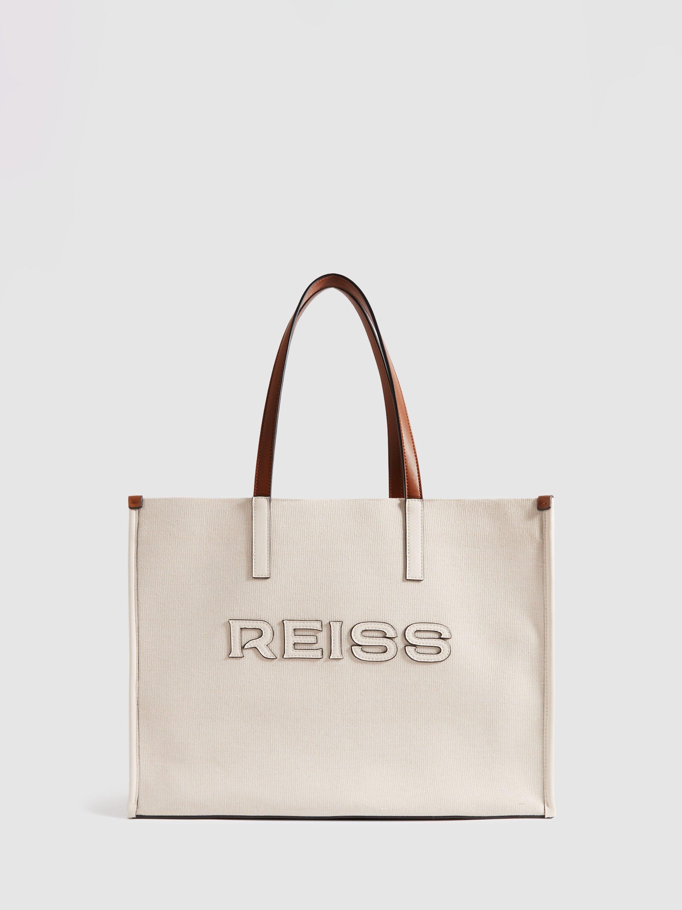 Product image 1 of 5, which shows Reiss Lola Woven Logo Tote Bag, Natural/Tan, One Size
