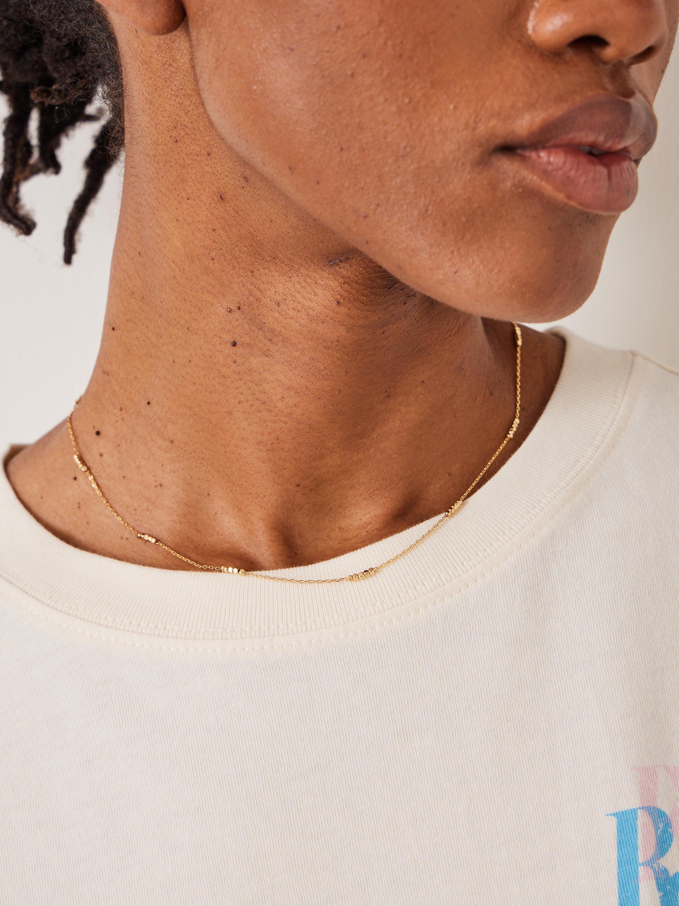 Product image 2 of 3, which shows HUSH Lyla Mini Bead Short Chain Necklace, Gold