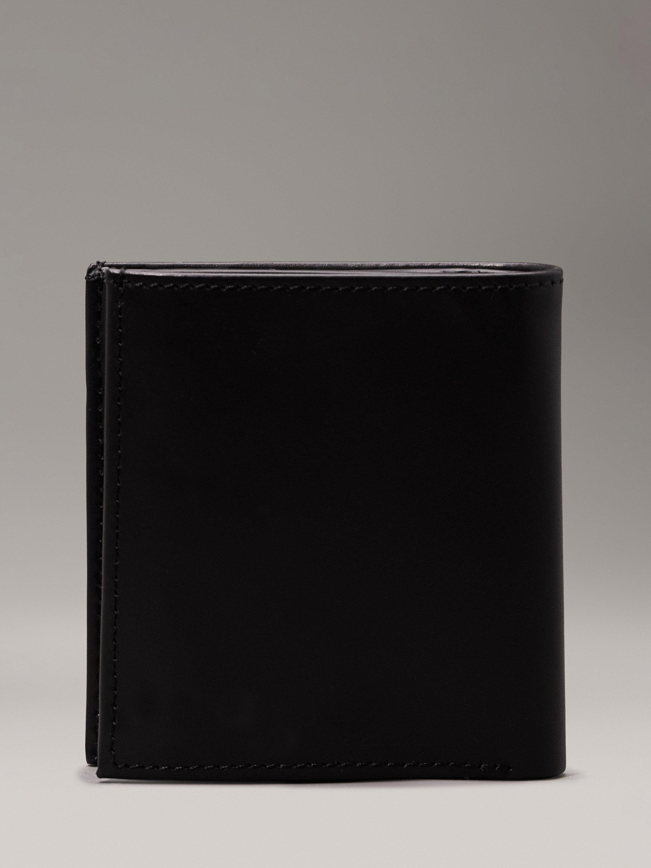 Product image 2 of 5, which shows Calvin Klein Smooth Leather Trifold Wallet, Ck Black