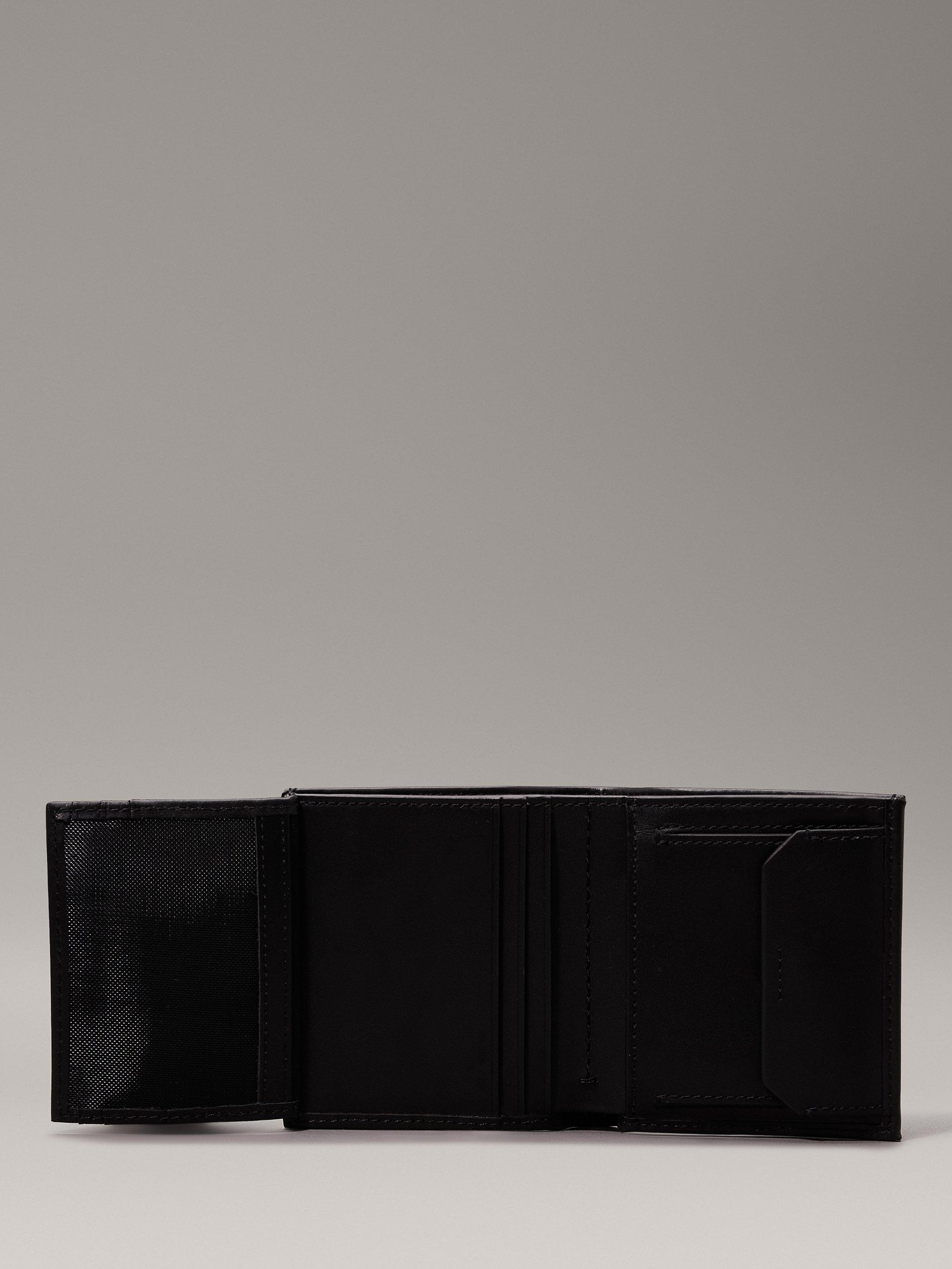 Product image 3 of 5, which shows Calvin Klein Smooth Leather Trifold Wallet, Ck Black