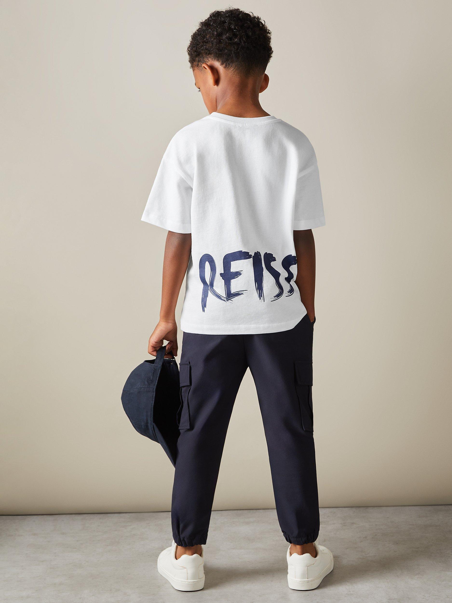 Product image 2 of 4, which shows Reiss Kids' Abbott Paintstroke Logo T-Shirt, Optic White, 13-14 years