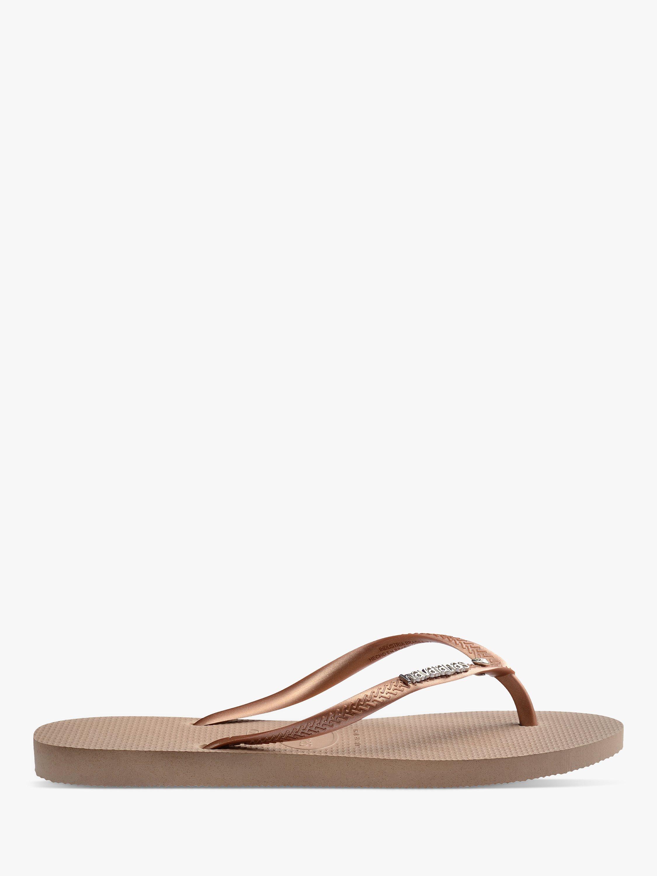 Product image 1 of 6, which shows Havaianas Slim Metallic Logo Flip Flops, Rose Gold/Silver, 3/4