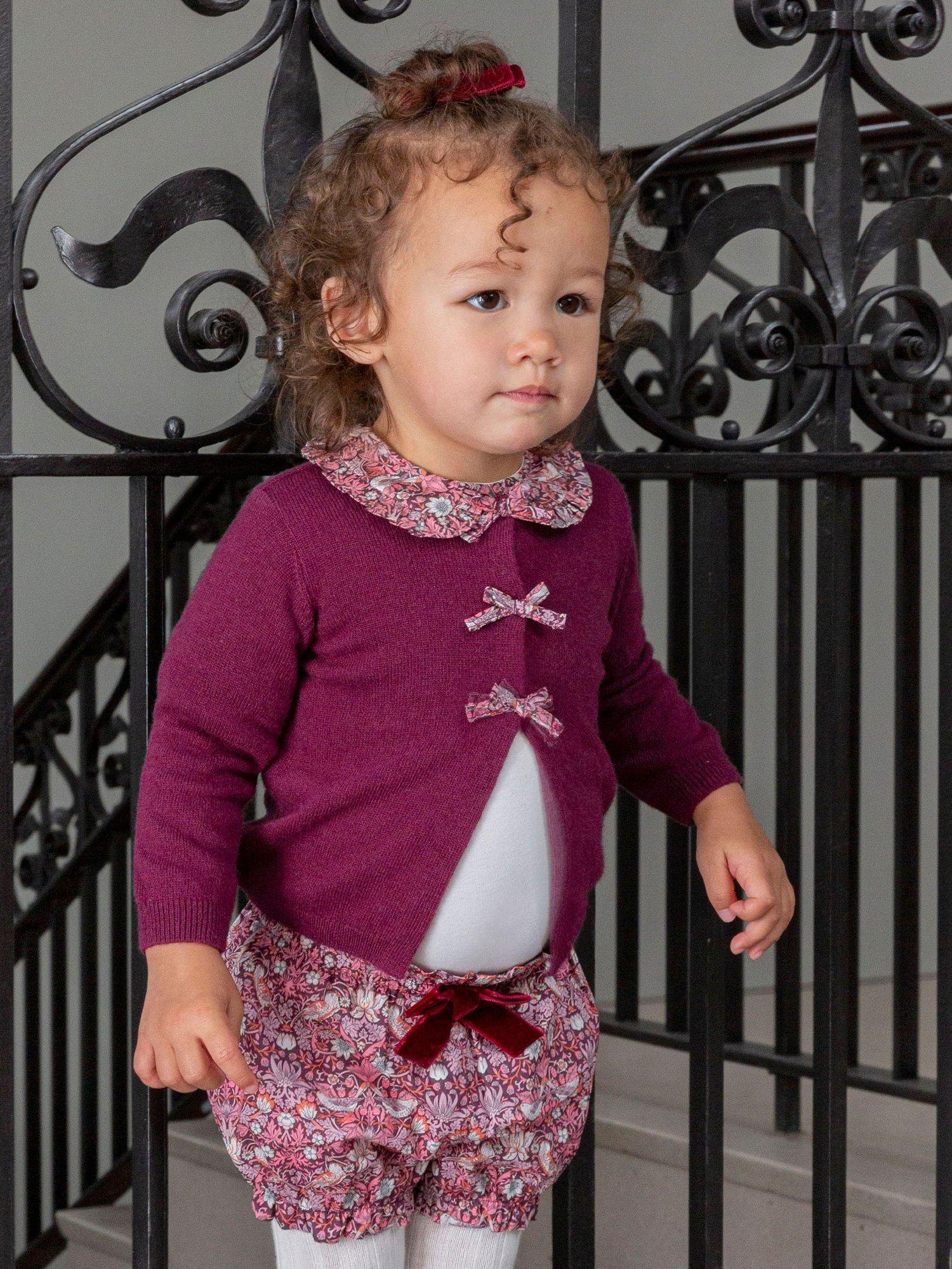 Product image 4 of 4, which shows Trotters Kids' Strawberry Thief Bow Wool Blend Cardigan, Plum/Strawberrythief, 2-3 years