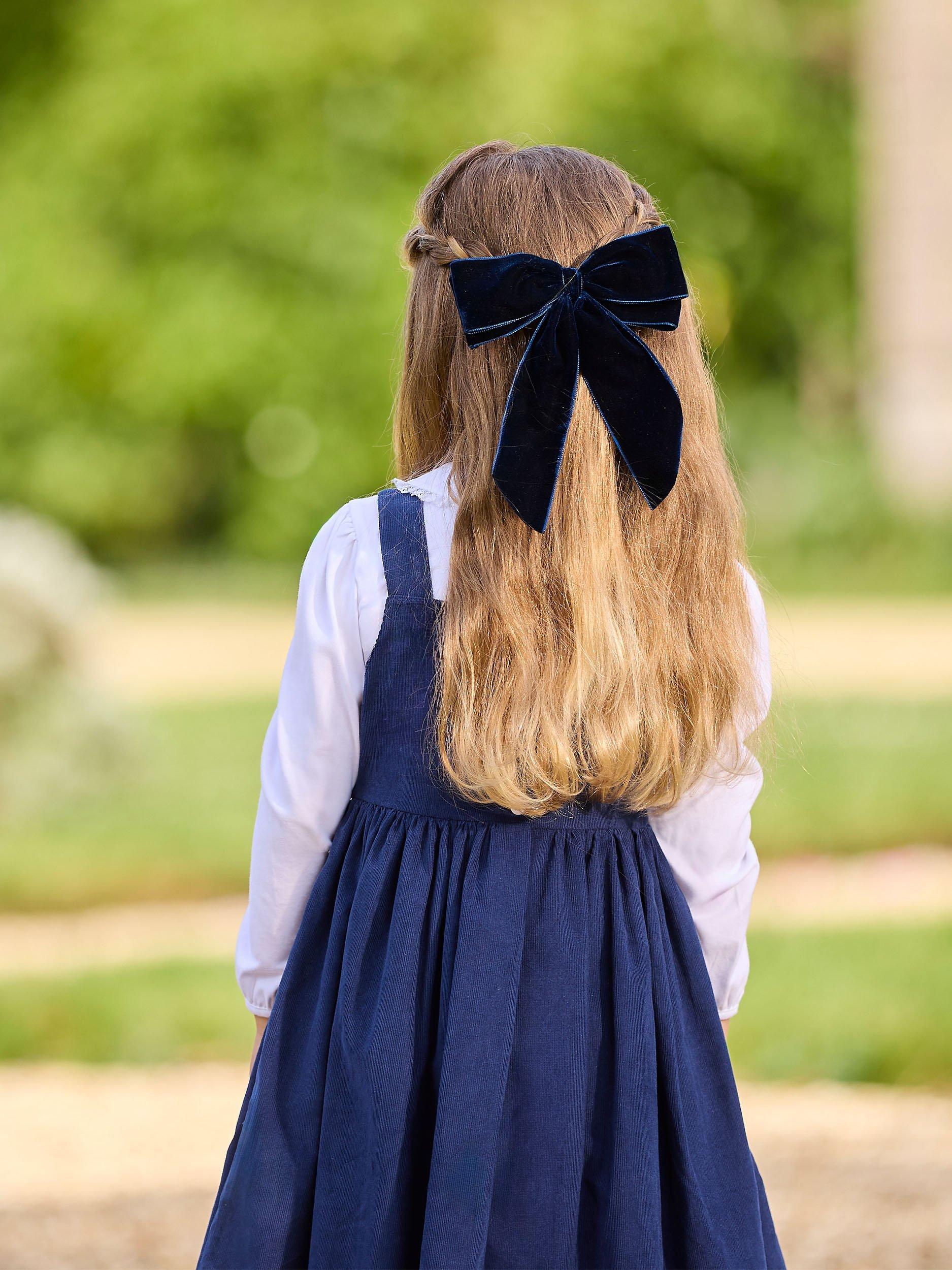 Product image 4 of 5, which shows Trotters Kids' Duck Pinafore Dress, Navy, 2 years