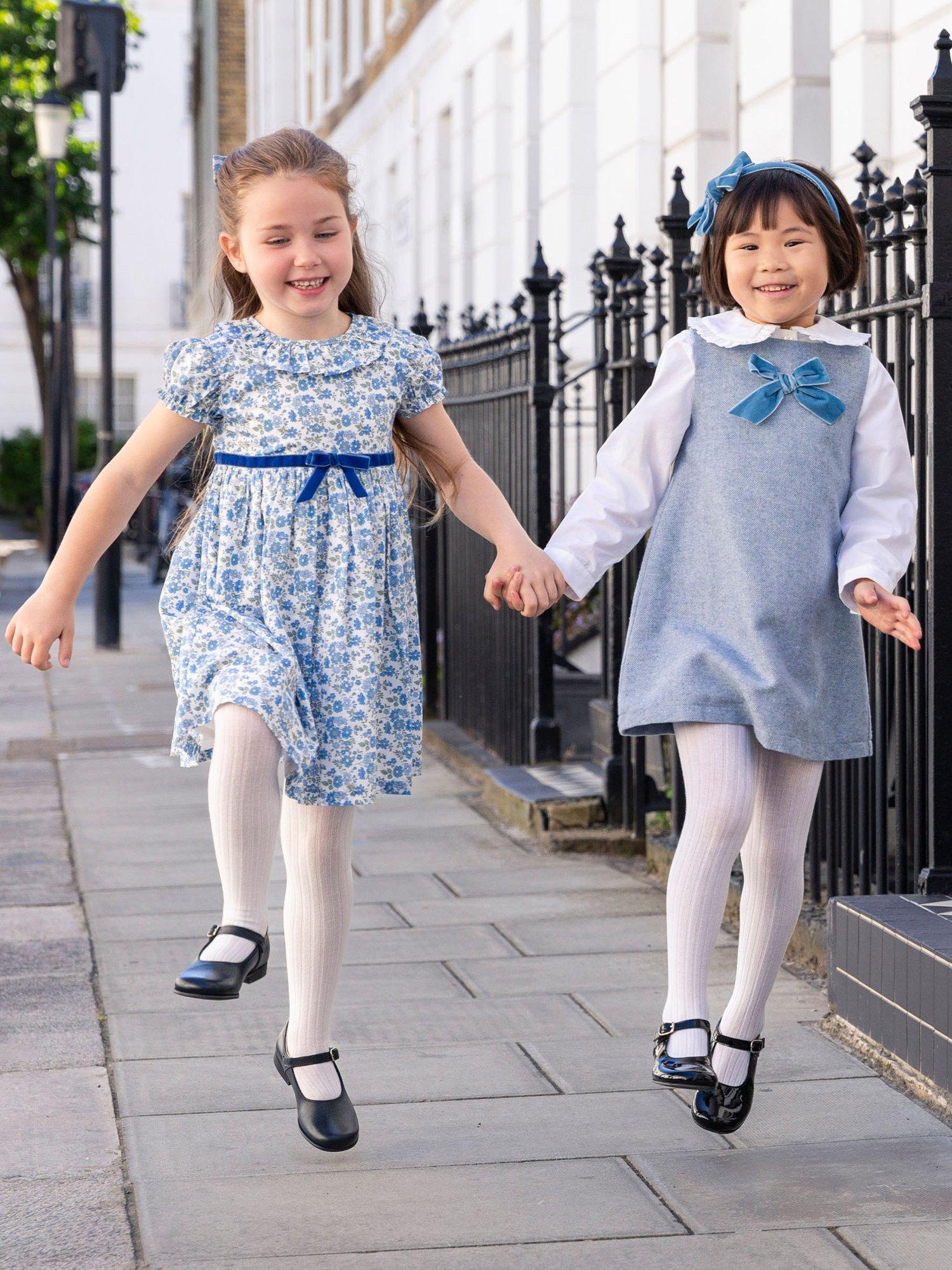 Product image 5 of 6, which shows Trotters Kids' Georgina Velvet Bow Dress, Blue, 2 years