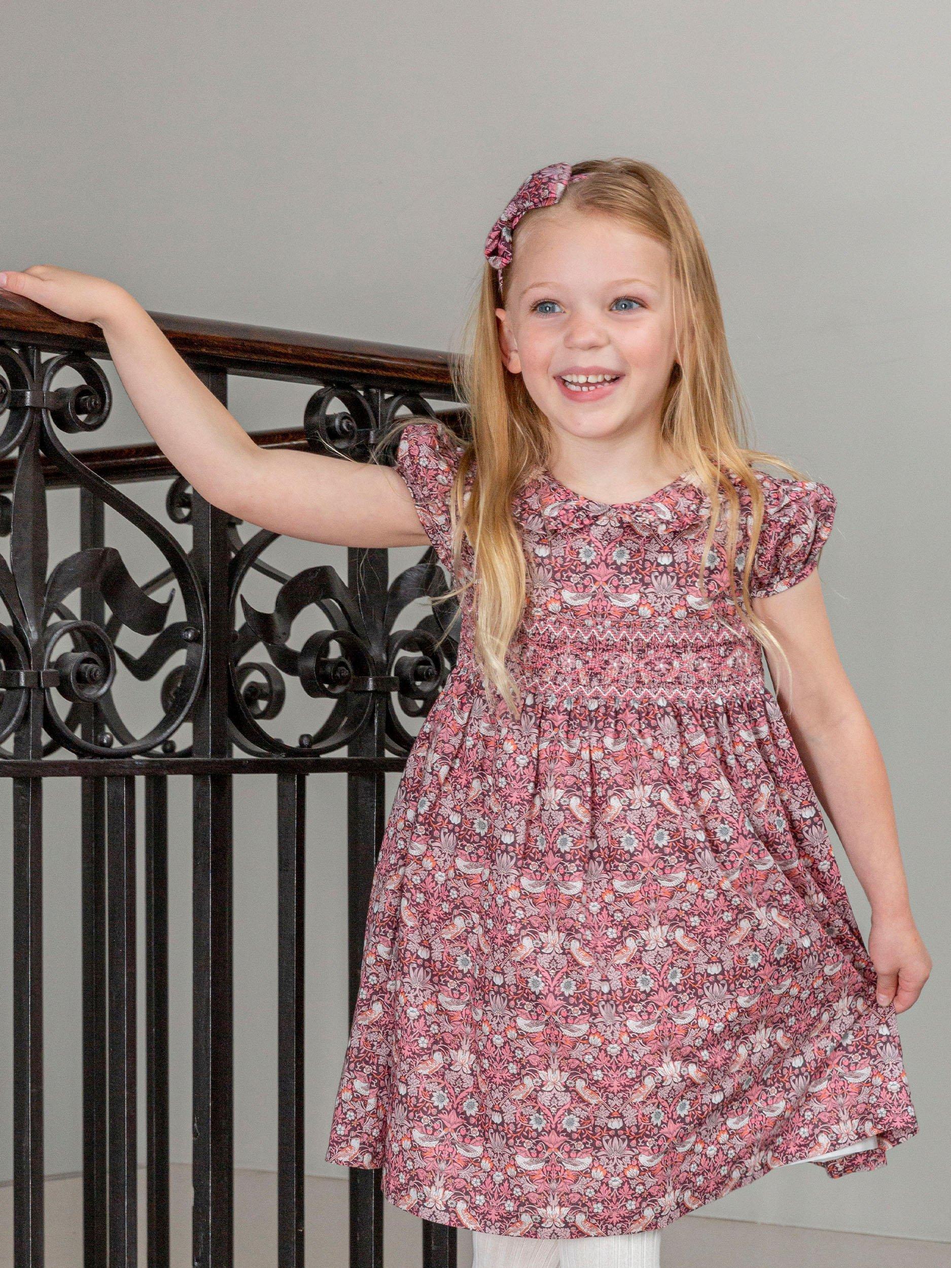 Product image 6 of 6, which shows Trotters Kids' Strawberry Thief Smocked Dress, Multi, 2 years