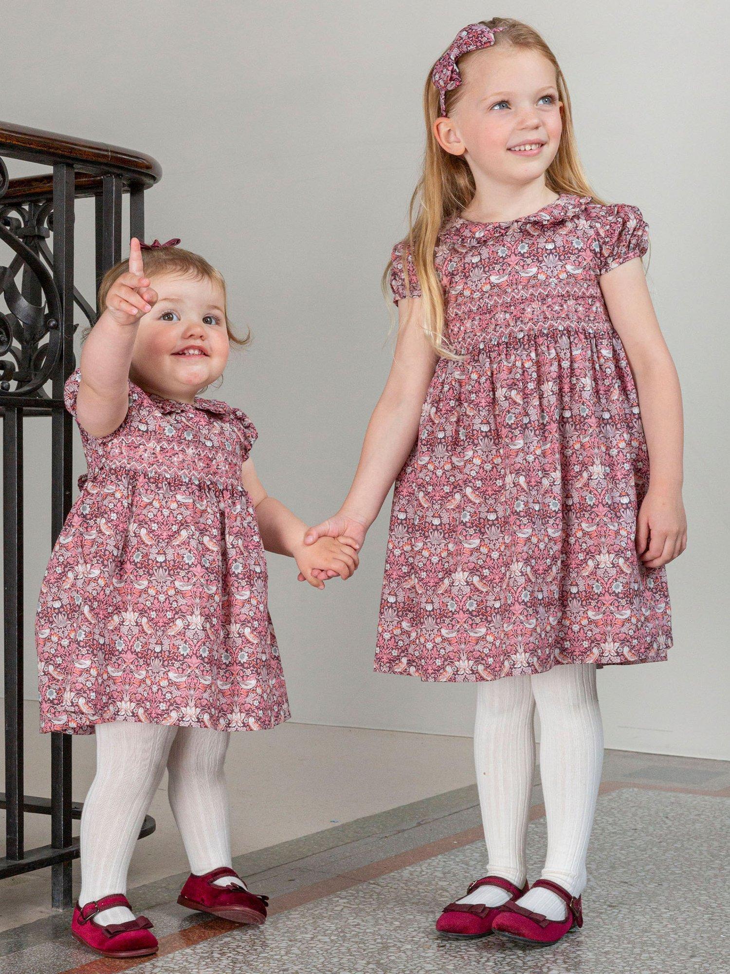Product image 4 of 6, which shows Trotters Kids' Strawberry Thief Smocked Dress, Multi, 2 years