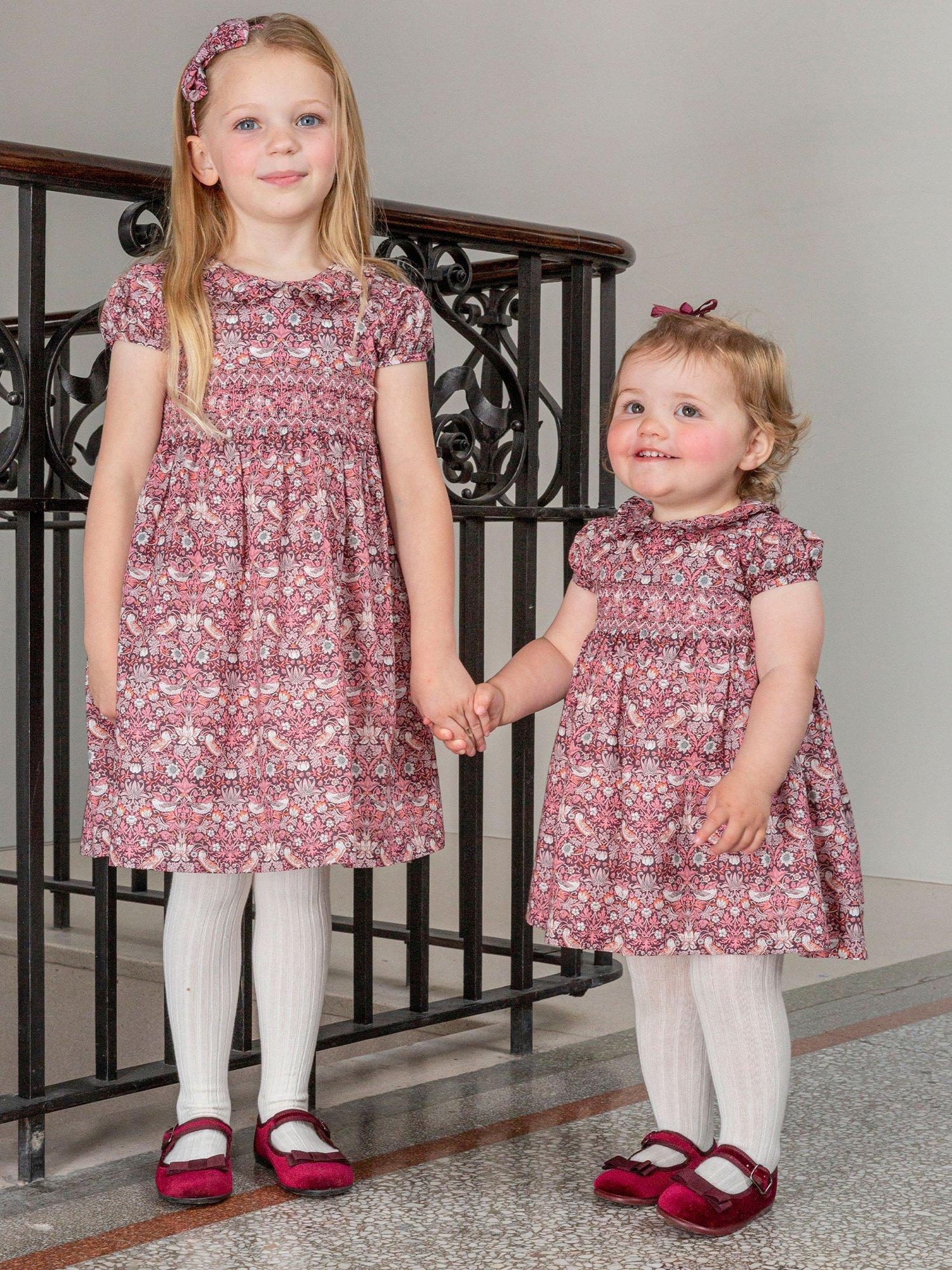 Product image 5 of 6, which shows Trotters Kids' Strawberry Thief Smocked Dress, Multi, 2 years