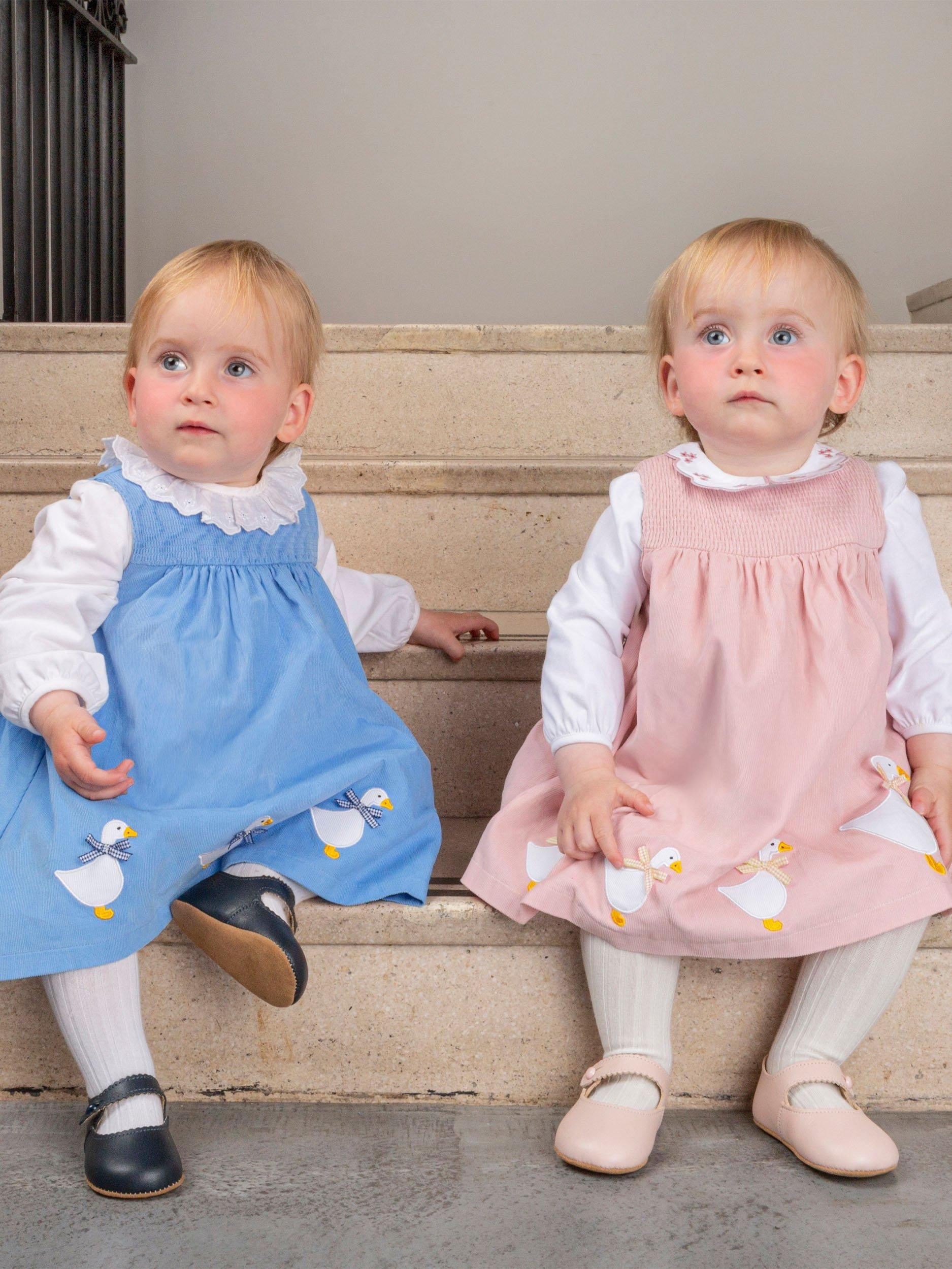 Product image 4 of 5, which shows Trotters Baby Ducks Pinafore, Pink Cord, 1-3 months