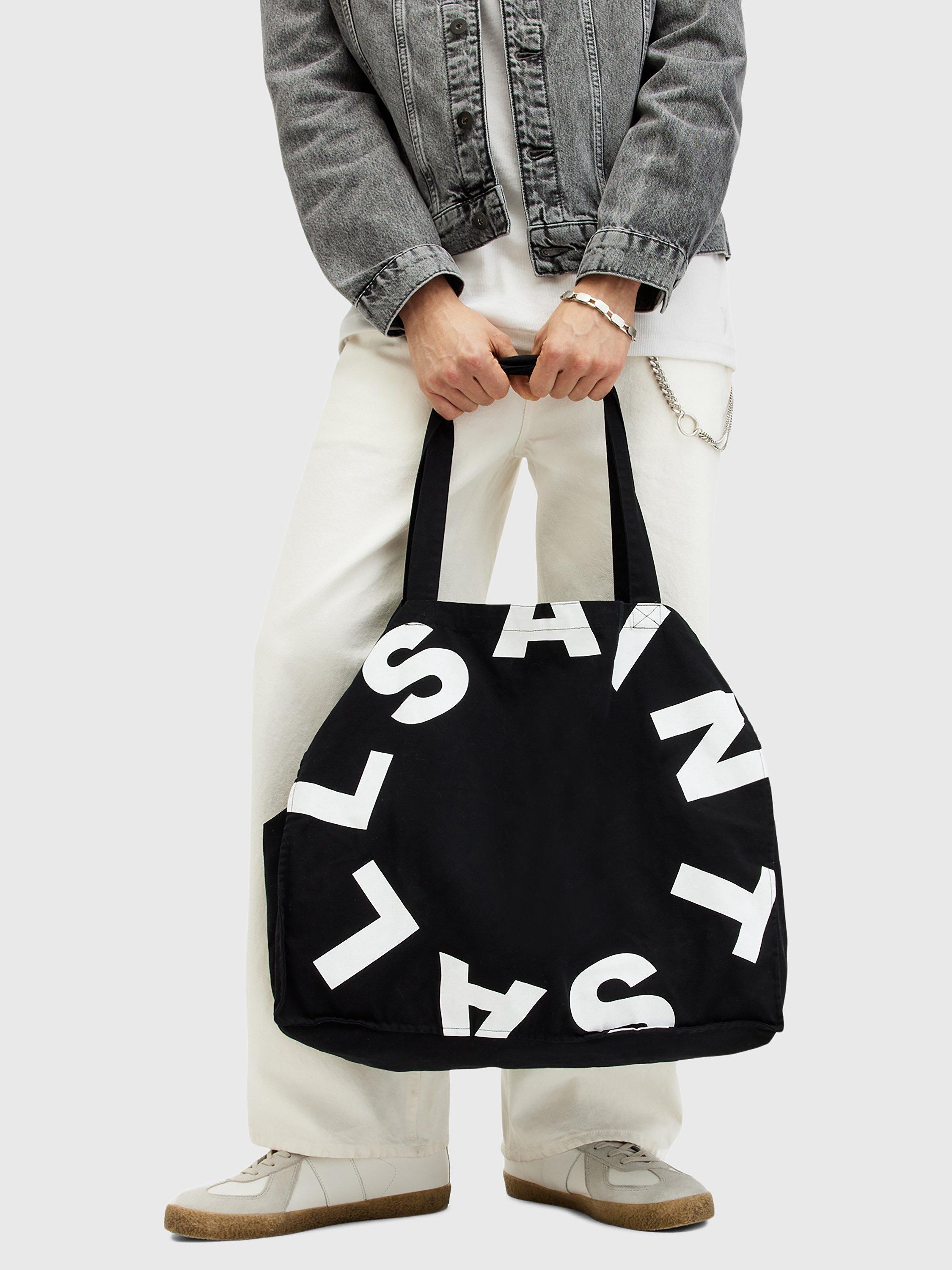 Product image 5 of 6, which shows AllSaints Tierra Large Cotton Tote Bag, Black/White, One Size