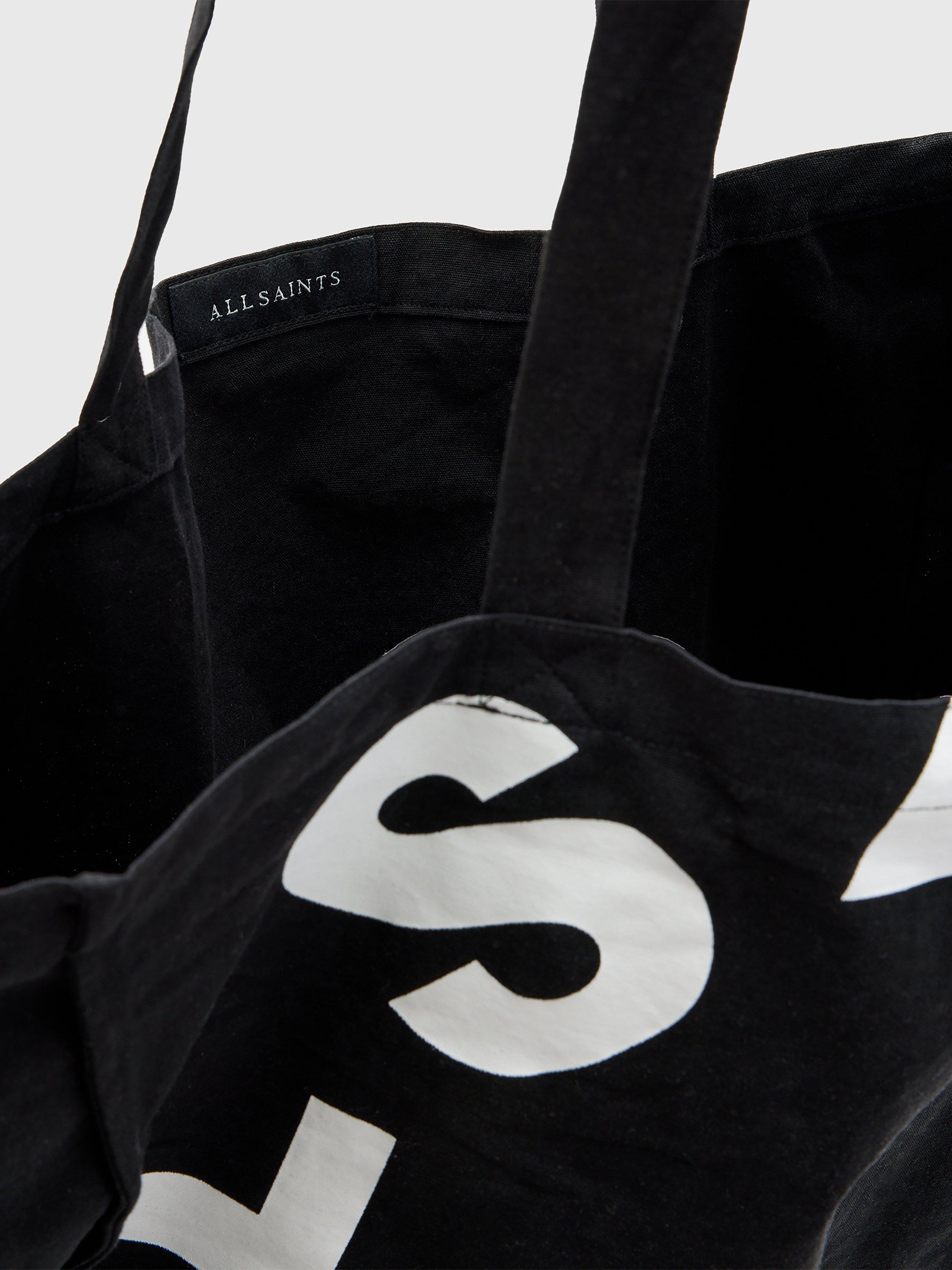 Product image 4 of 6, which shows AllSaints Tierra Large Cotton Tote Bag, Black/White, One Size