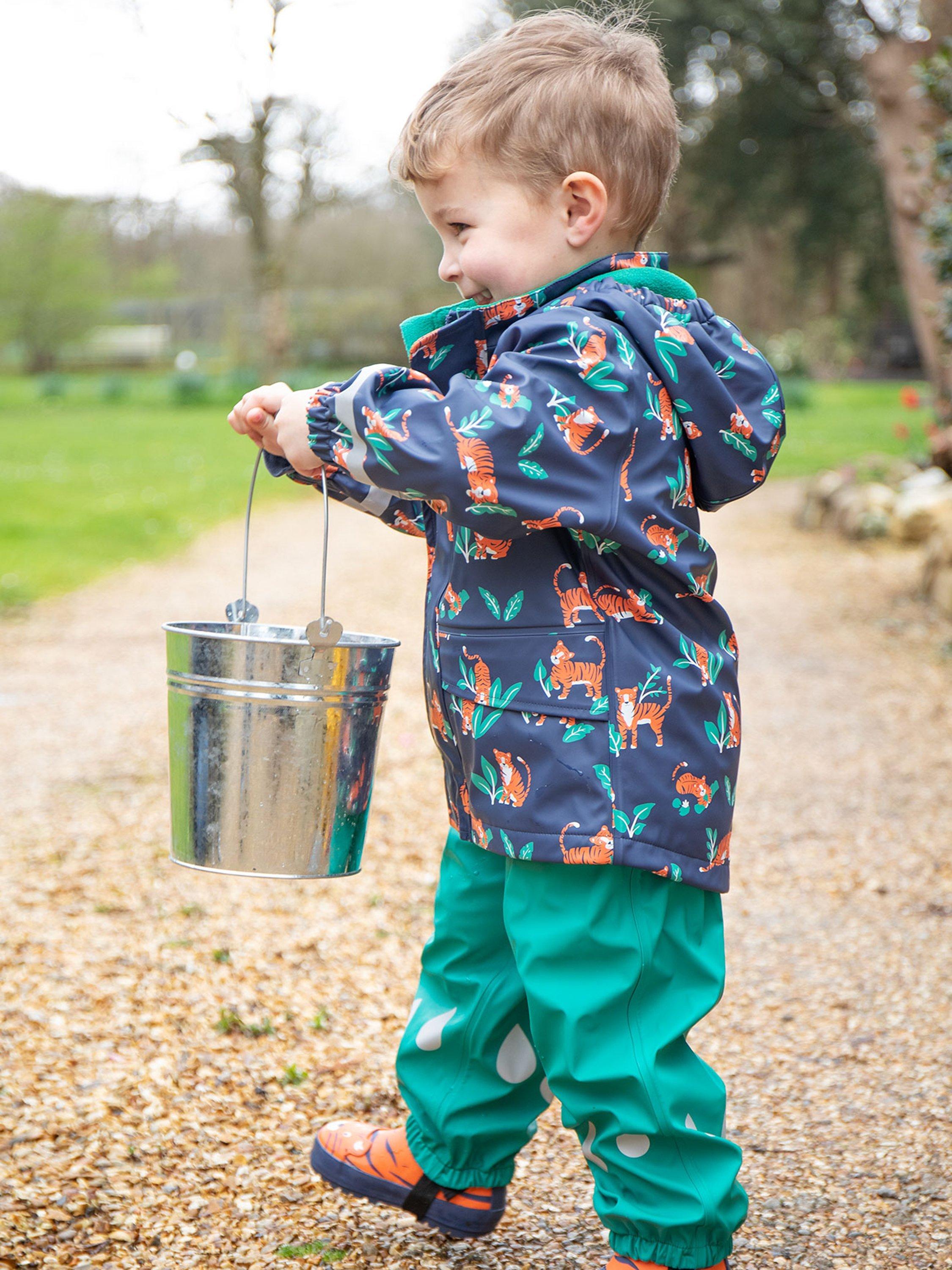 Product image 2 of 6, which shows Frugi Kids' Puddle Buster Waterproof Trousers, Iguana, 1-2 years