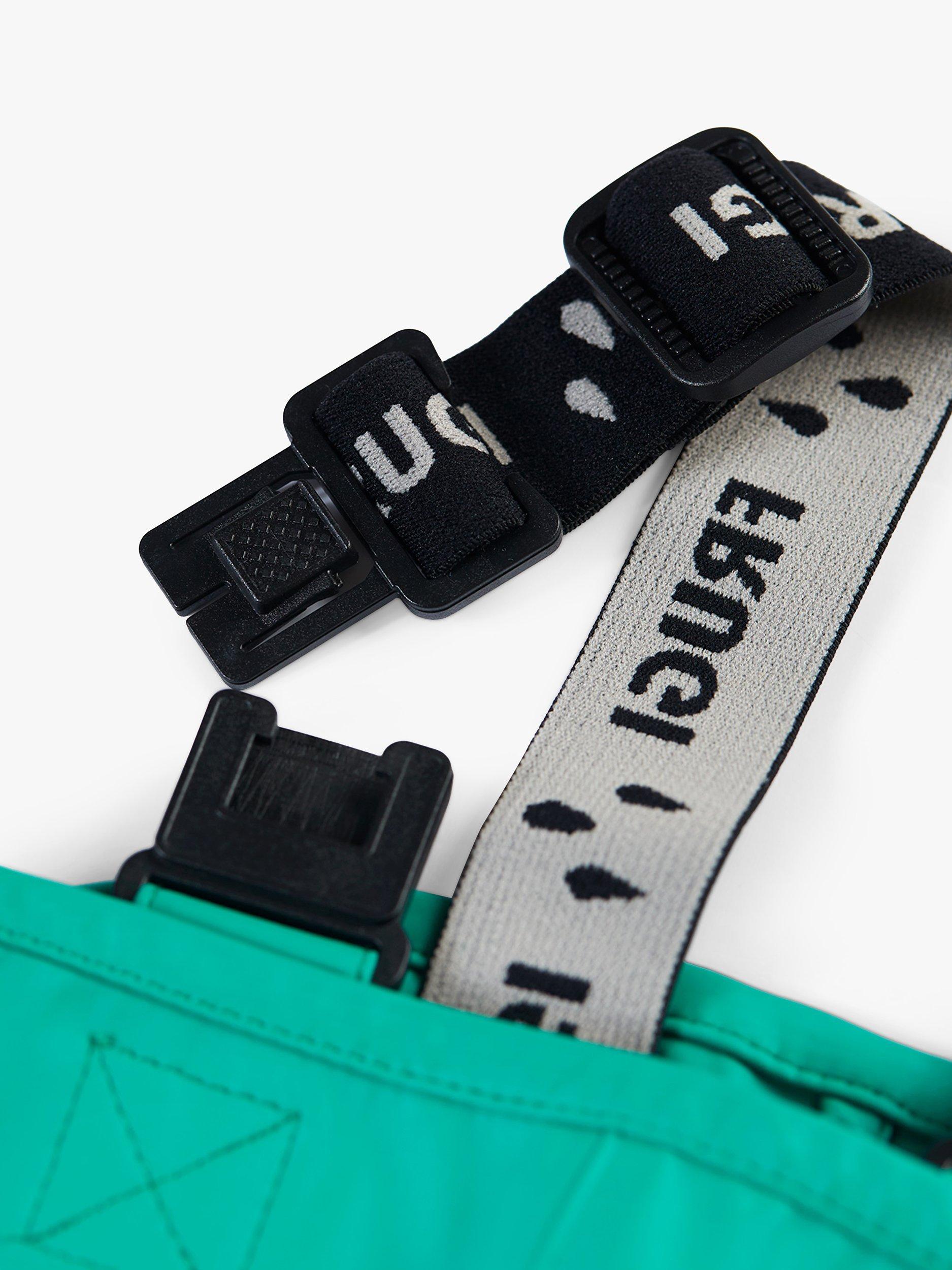 Product image 4 of 6, which shows Frugi Kids' Puddle Buster Waterproof Trousers, Iguana, 1-2 years
