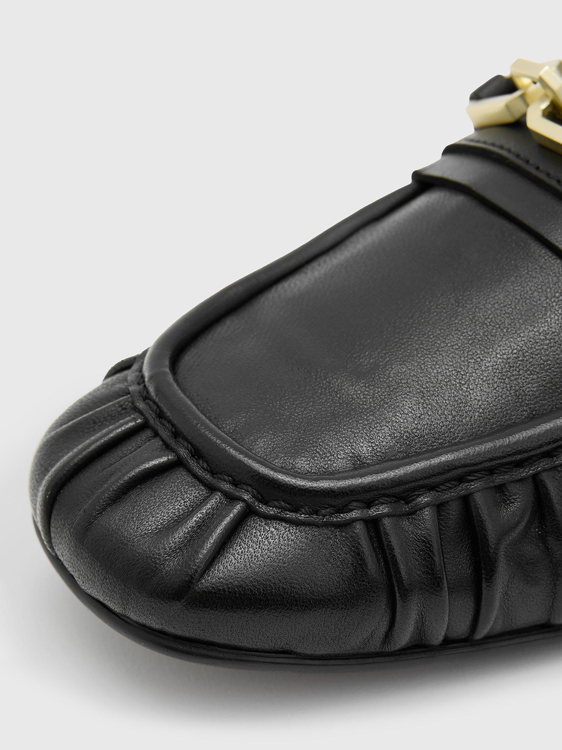 Product image 6 of 7, which shows AllSaints Sapphire Leather Snaffle Detail Loafers, Black, EU35
