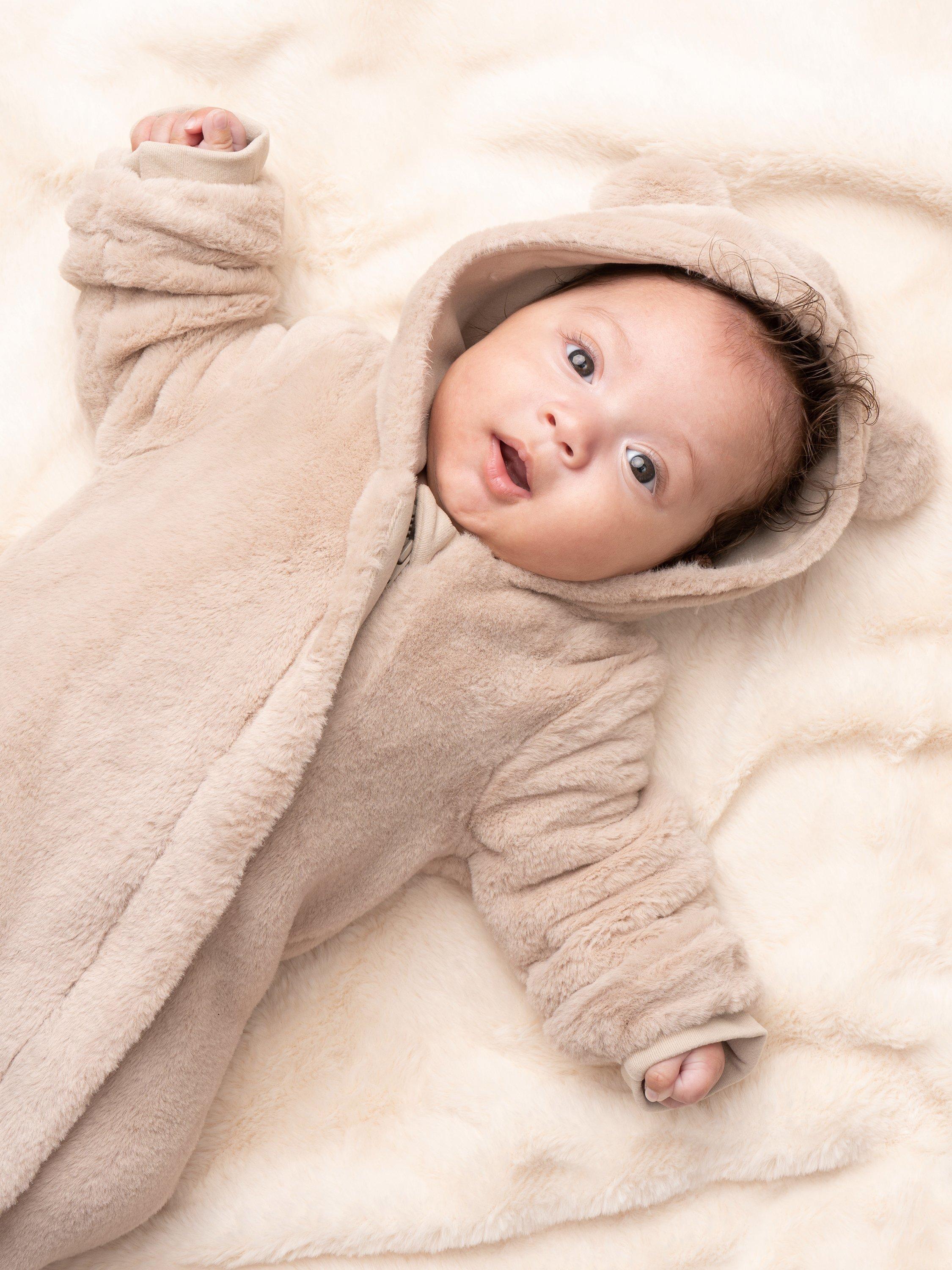 Product image 2 of 5, which shows Angel & Rocket Baby Faux Fur Pramsuit, Beige, 0-3 months