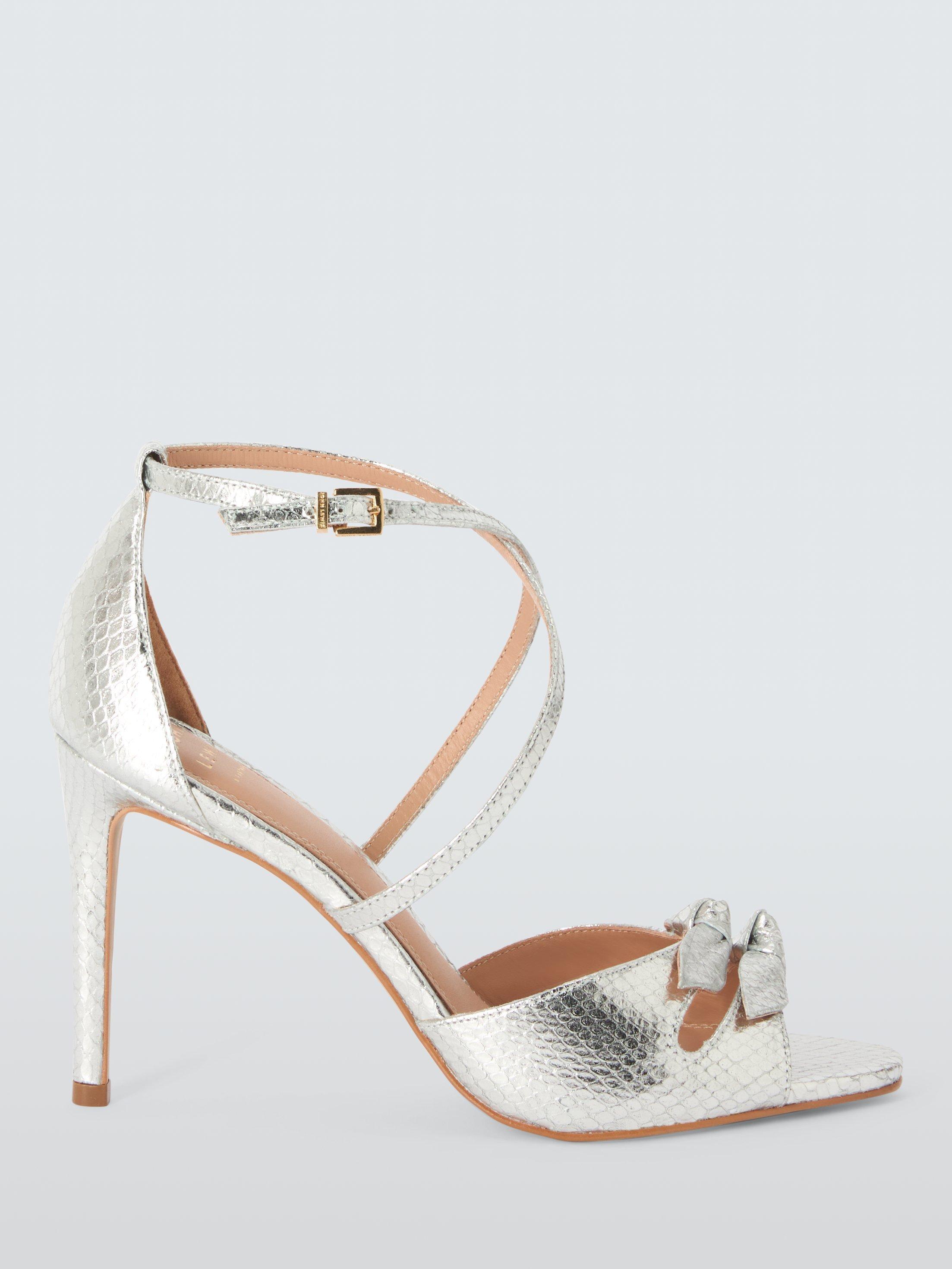 Product image 1 of 6, which shows John Lewis Magnolia Leather Double Bow Cross Strap High Heel Sandals, Silver Snake, 8