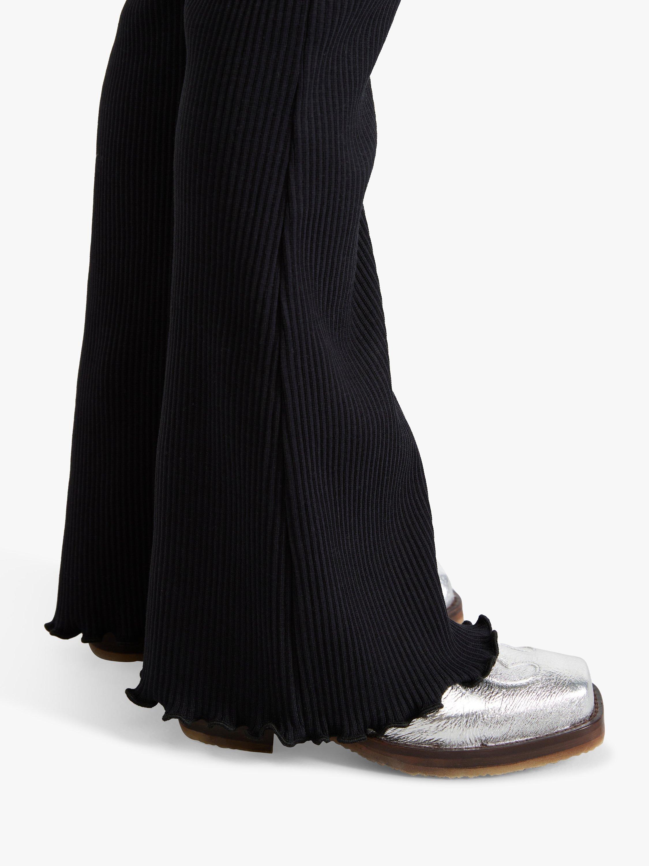 Product image 4 of 7, which shows Lindex Kids' Rib Flare Leggings, Black, 4-5 years