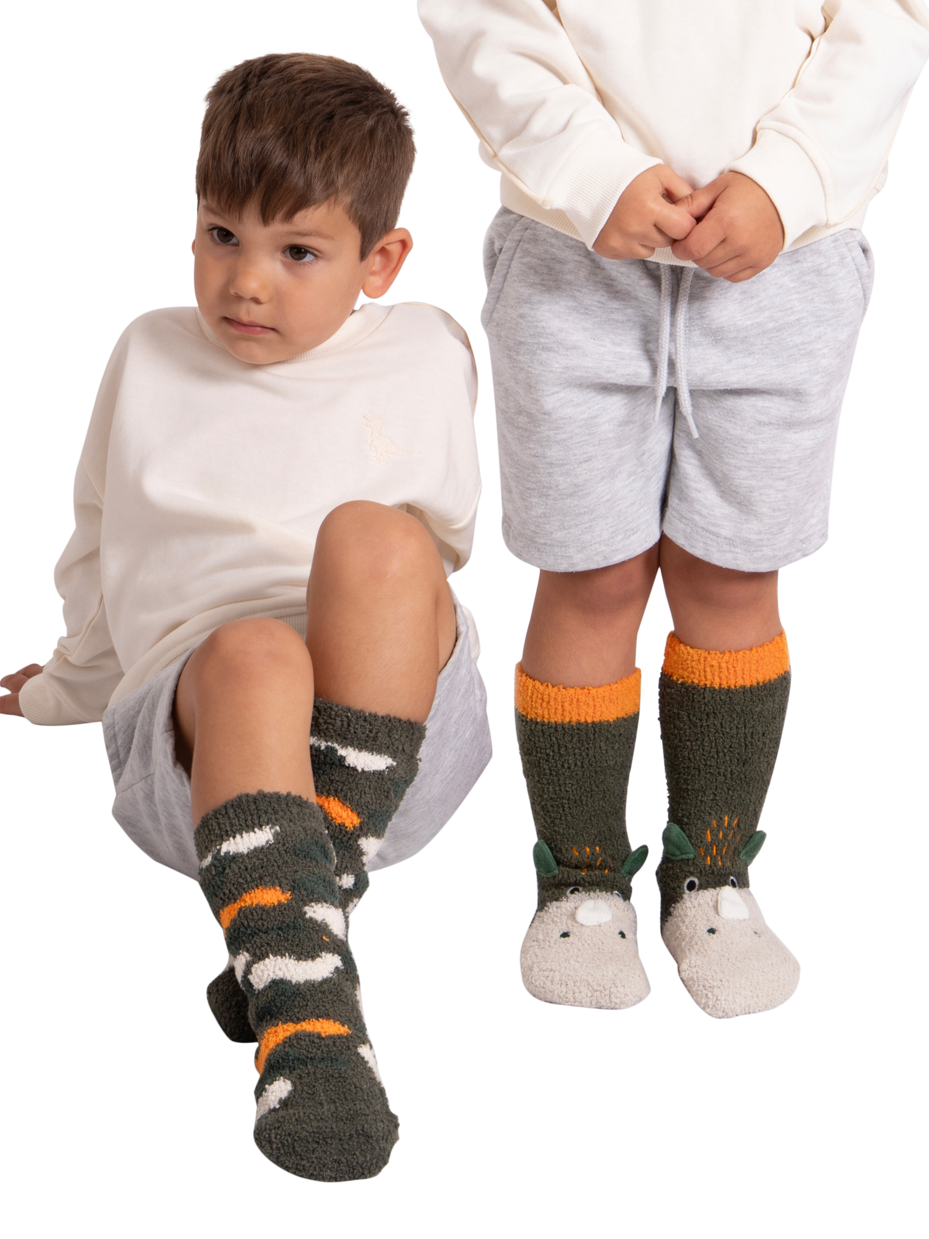 Product image 2 of 4, which shows totes Kids' Dinosaur & Camouflage Slipper Socks, Pack of 2, Multi, 6-8.5