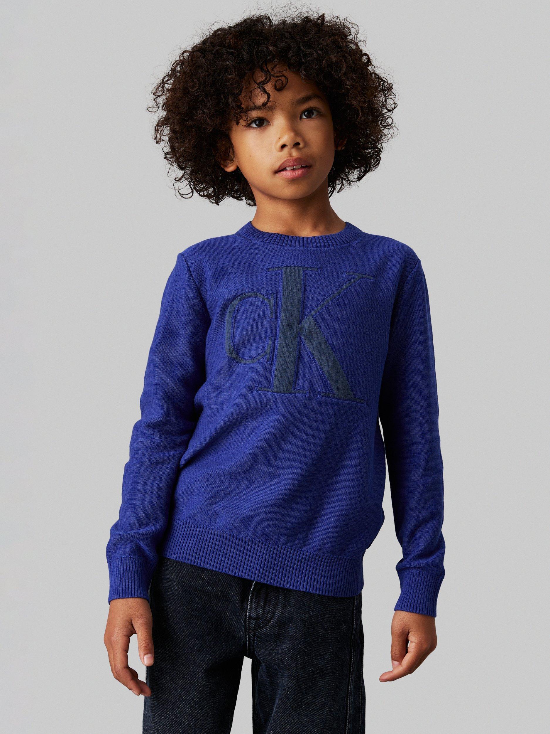 Product image 1 of 4, which shows Calvin Klein Kids' Organic Cotton Monogram Logo Jumper, Pigment Blue, 10 years