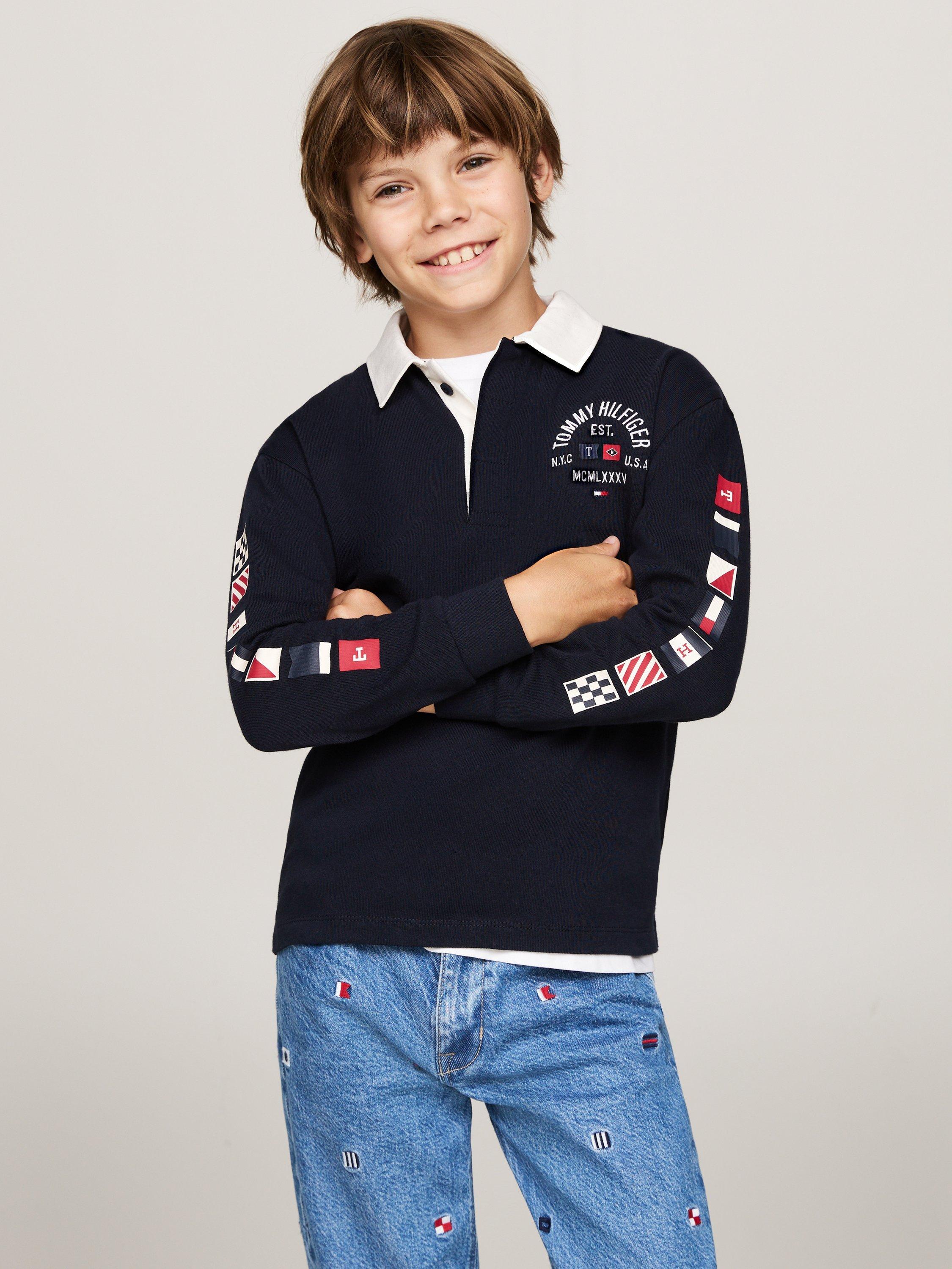 Product image 1 of 4, which shows Tommy Hilfiger Kids' Flags Long Sleeve Polo Shirt, Desert Sky, 12 years