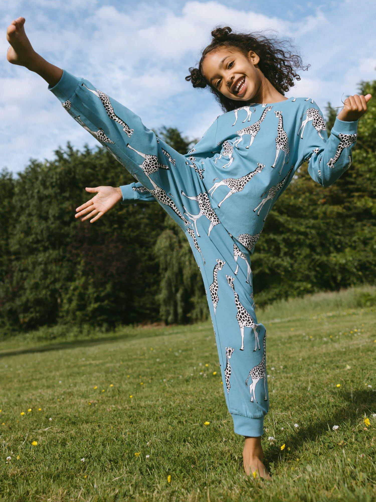 Product image 1 of 4, which shows Chelsea Peers Kids' Organic Cotton Giraffe Print Pyjamas, Blue/Multi, 1-2 years