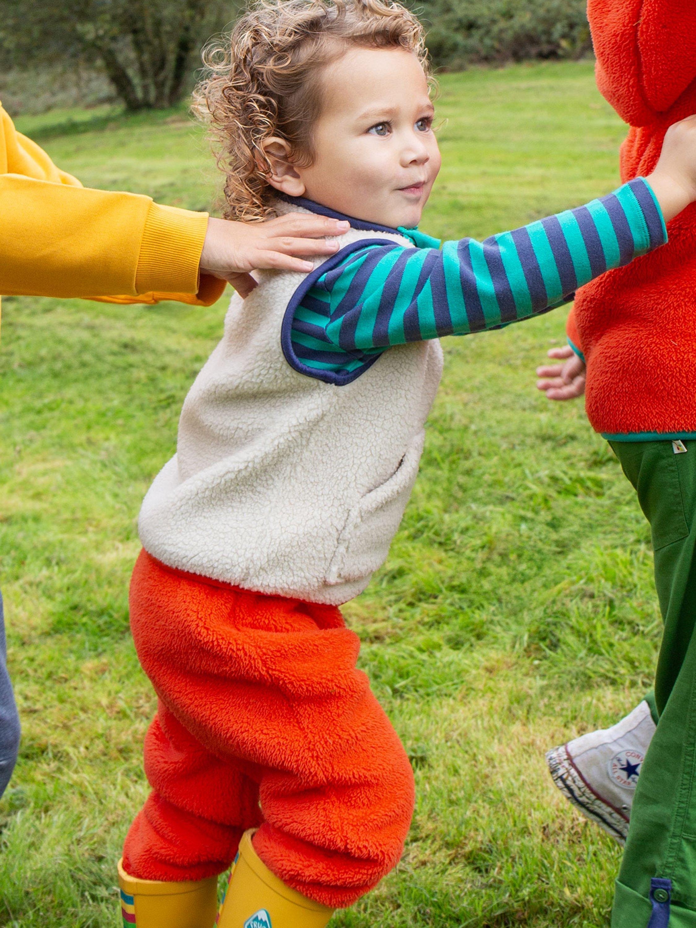 Product image 2 of 4, which shows Frugi Baby Ted Fleece Pull Up Trousers, Bonfire, 0-3 months