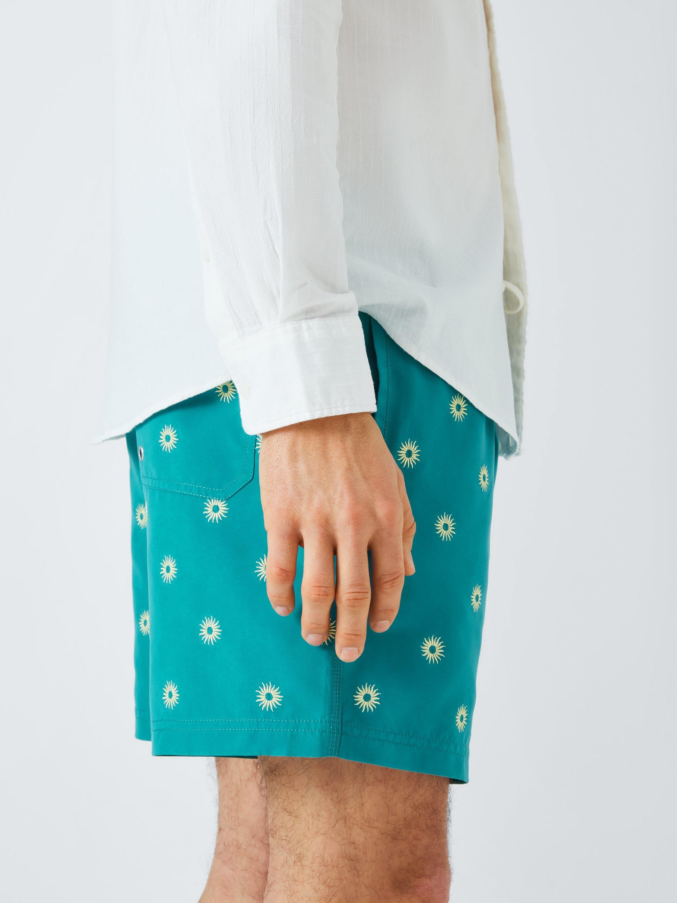 Product image 5 of 6, which shows John Lewis Embroidered Sun Swim Shorts, Dark Green, S