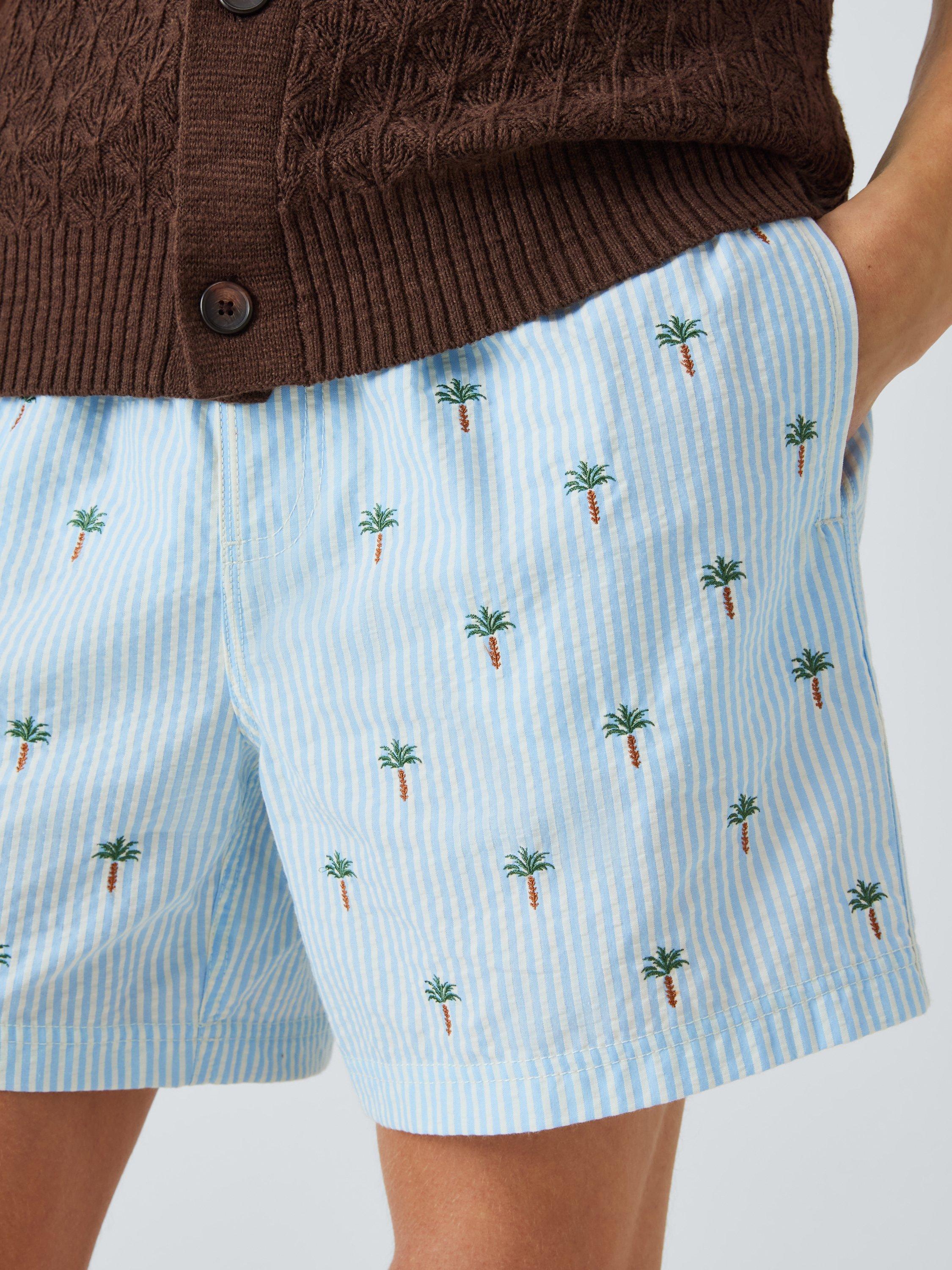 Product image 5 of 6, which shows John Lewis Embroidered Palm Seersucker Swim Shorts, Blue Multi, S