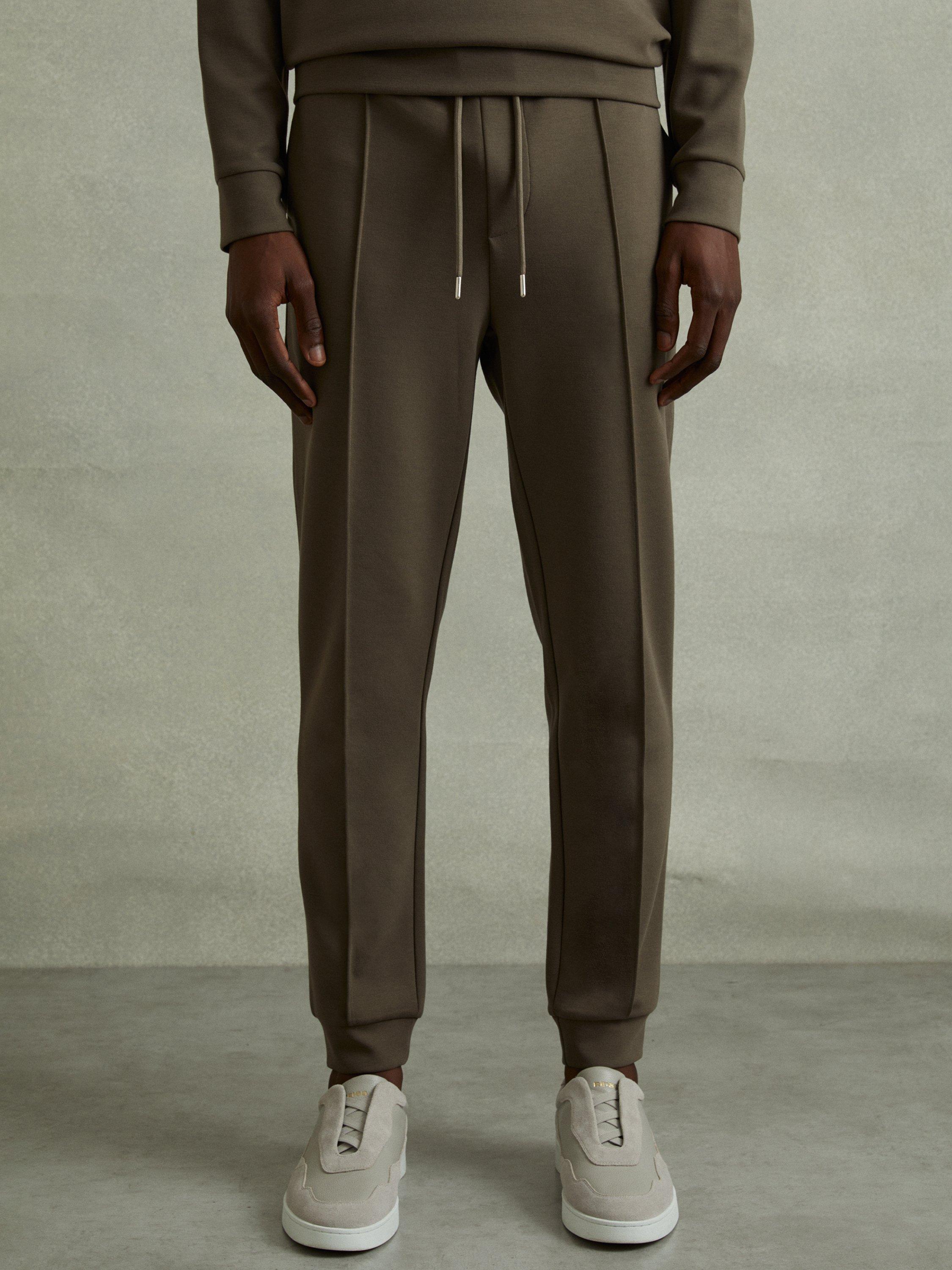 Product image 1 of 5, which shows Reiss Premier Jogger Trousers, Sage Green, XS