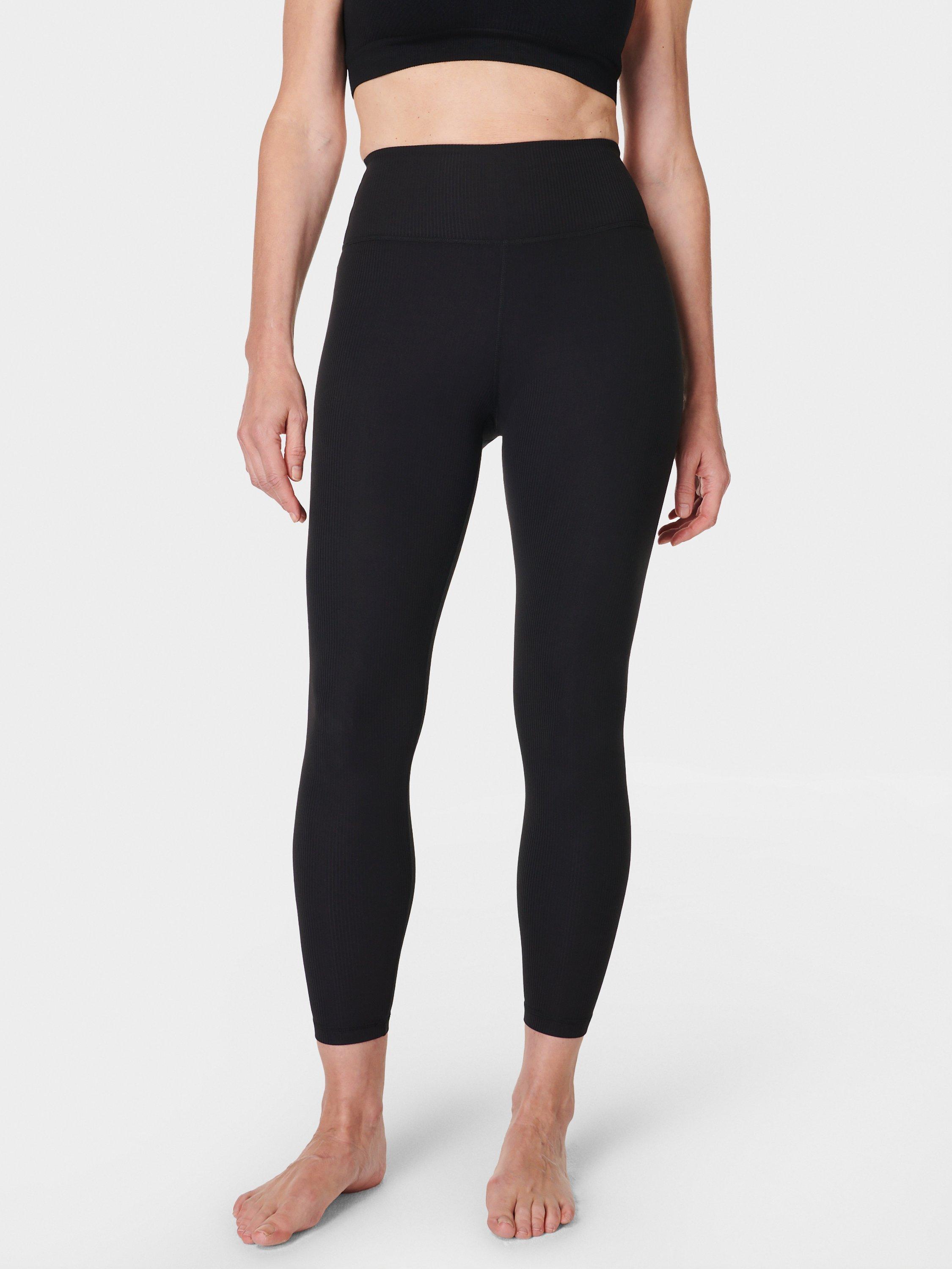 Product image 1 of 6, which shows Sweaty Betty Glow Flex Rib 7/8 Sports Leggings, Black, M
