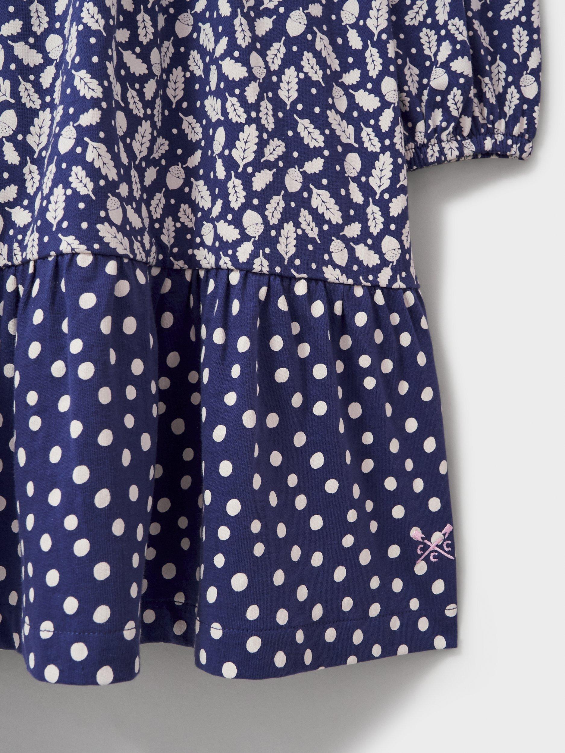 Product image 2 of 3, which shows Crew Clothing Kids' Long Sleeve Printed Tiered Jersey Dress, Navy/White, 8-9 years