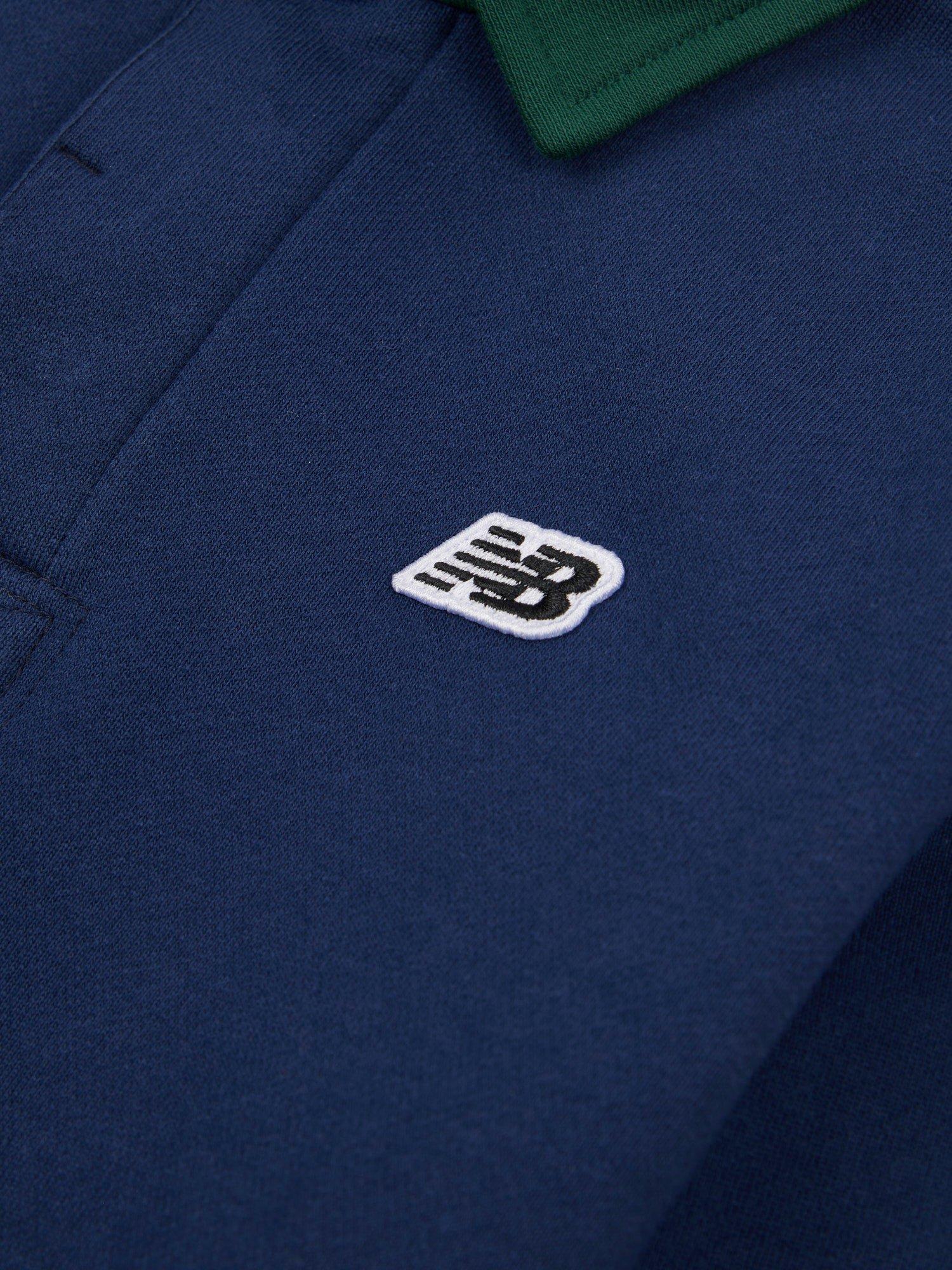 Product image 10 of 10, which shows New Balance Kids' Premium Rugby Shirt, Navy, 7-8 years
