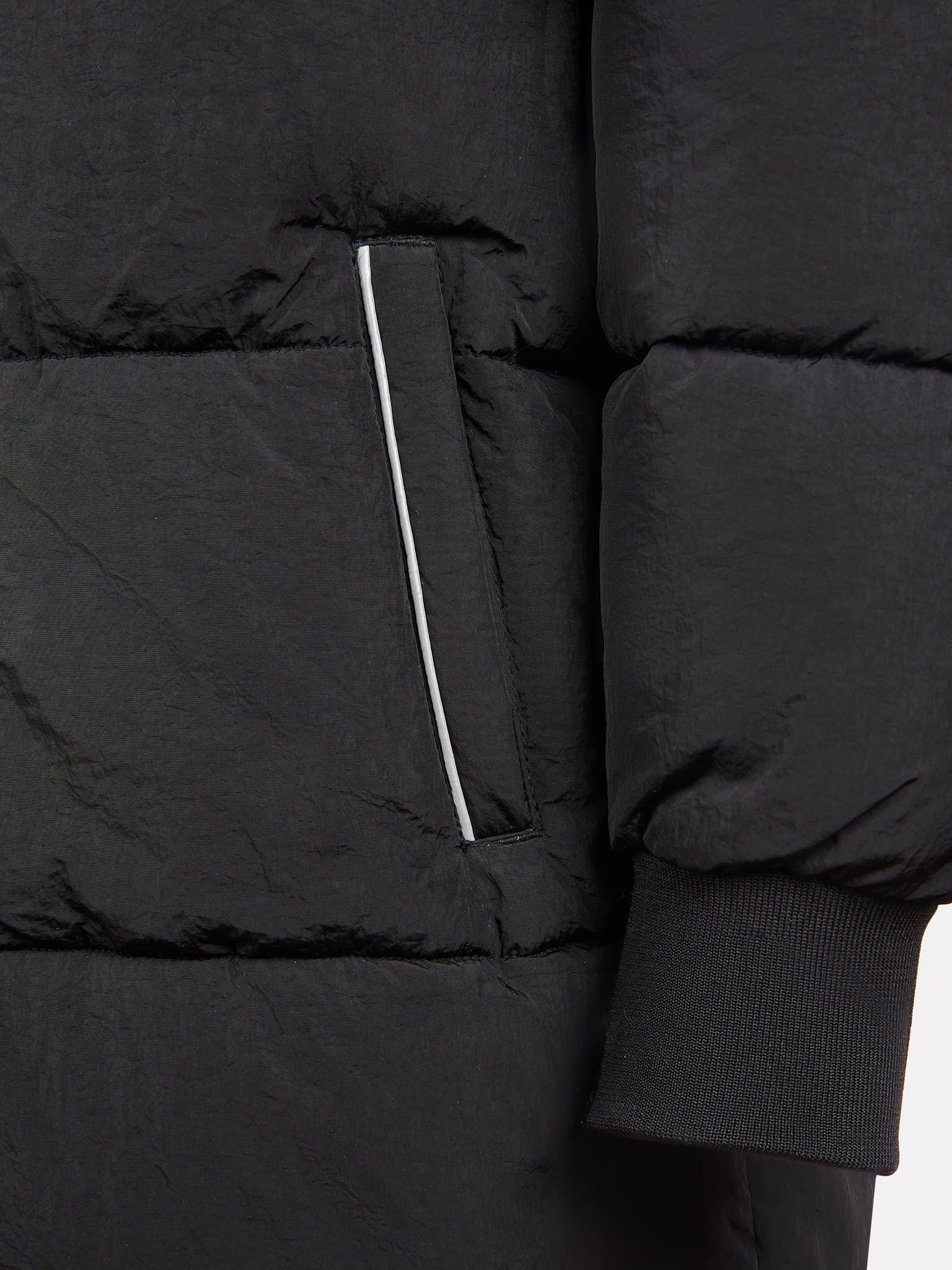 Product image 10 of 10, which shows New Balance Kids' Longline Puffer Coat, Caviar, 7-8 years