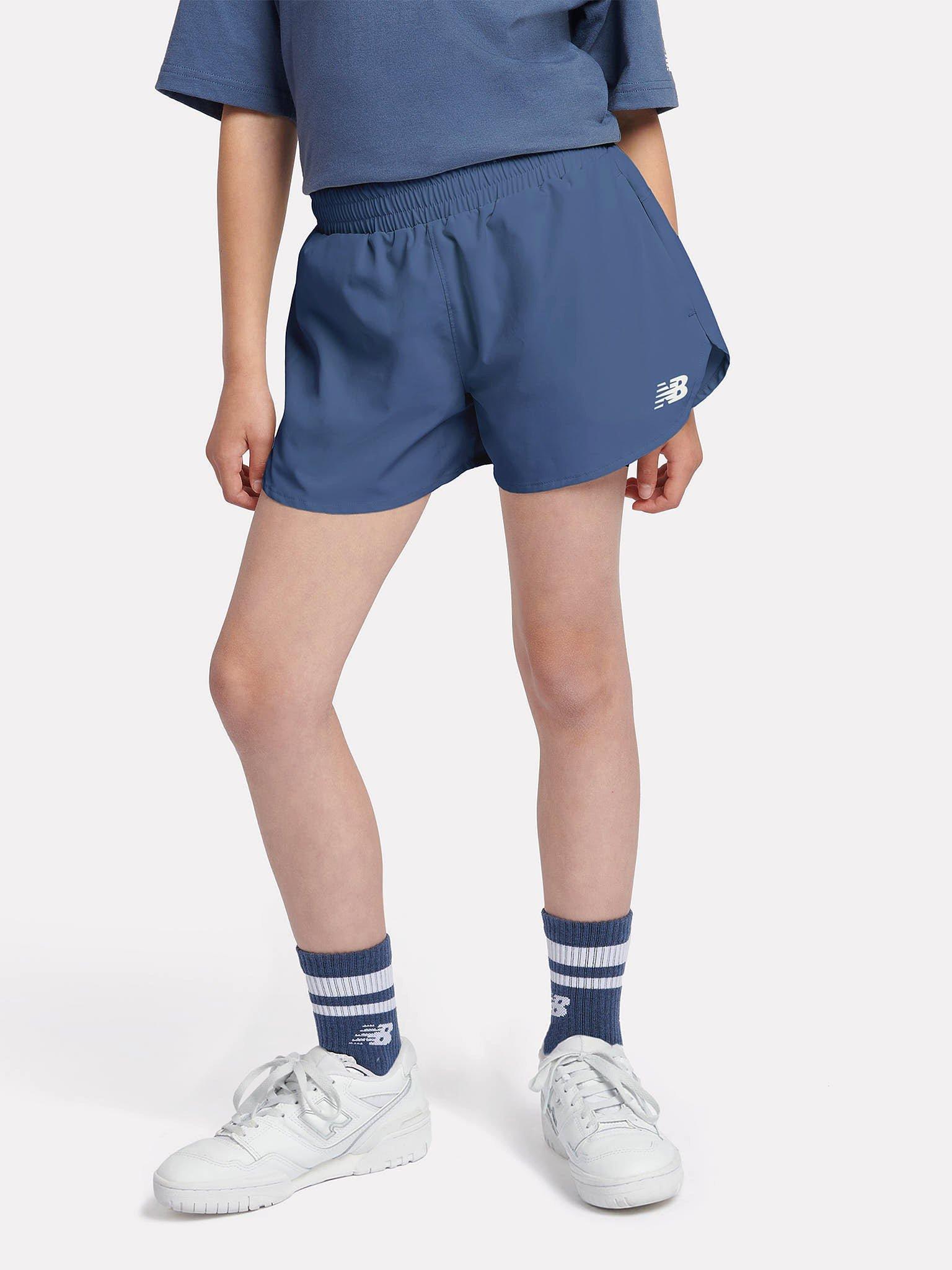 Product image 1 of 9, which shows New Balance Kids' Athletics Woven Shorts, Vintage Indigo, 7-8 years