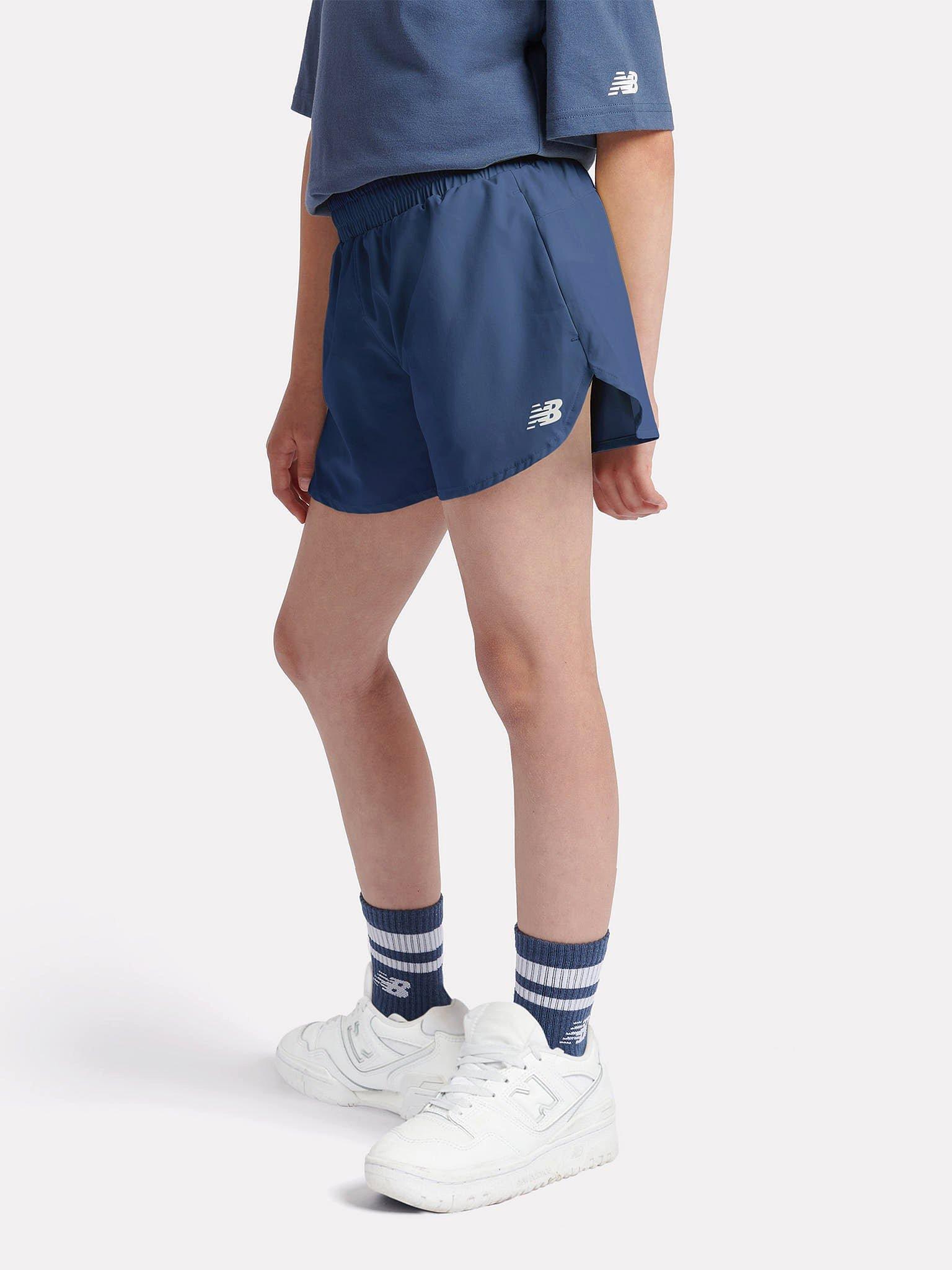 Product image 2 of 9, which shows New Balance Kids' Athletics Woven Shorts, Vintage Indigo, 7-8 years