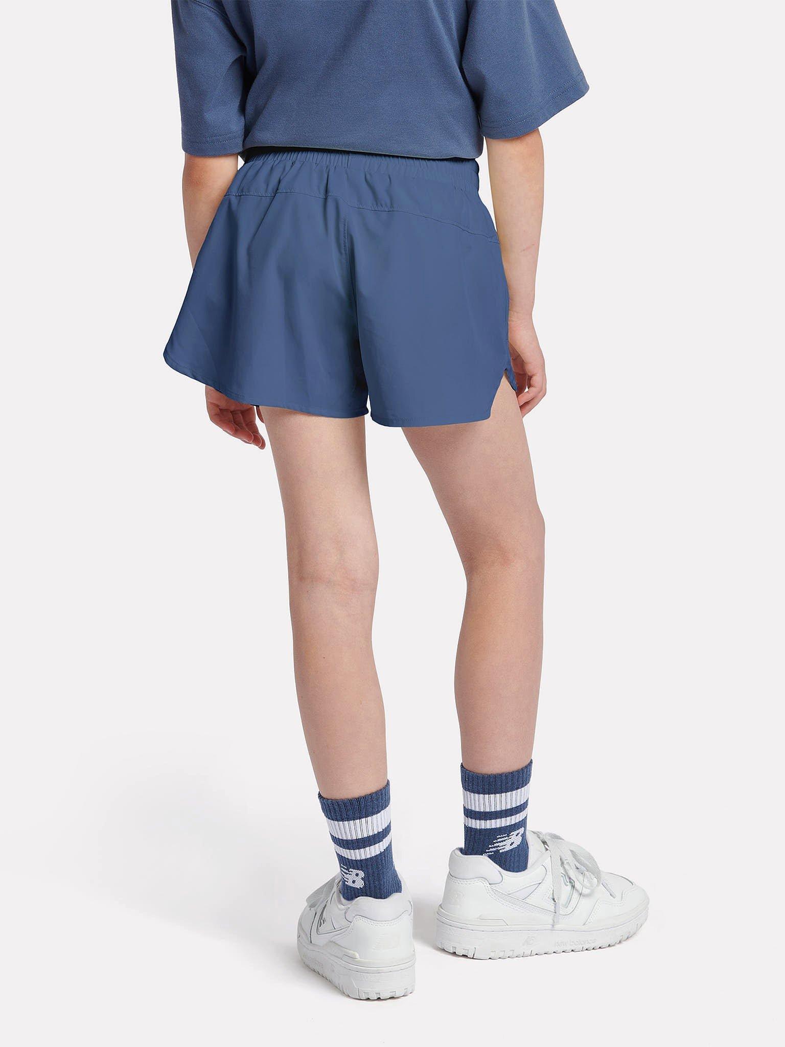 Product image 3 of 9, which shows New Balance Kids' Athletics Woven Shorts, Vintage Indigo, 7-8 years