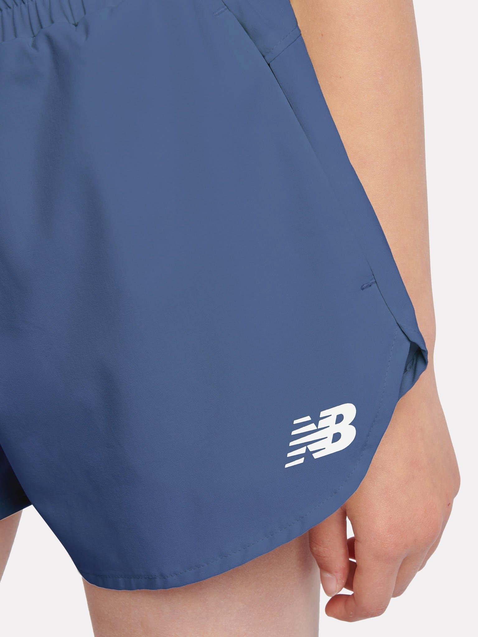 Product image 4 of 9, which shows New Balance Kids' Athletics Woven Shorts, Vintage Indigo, 7-8 years