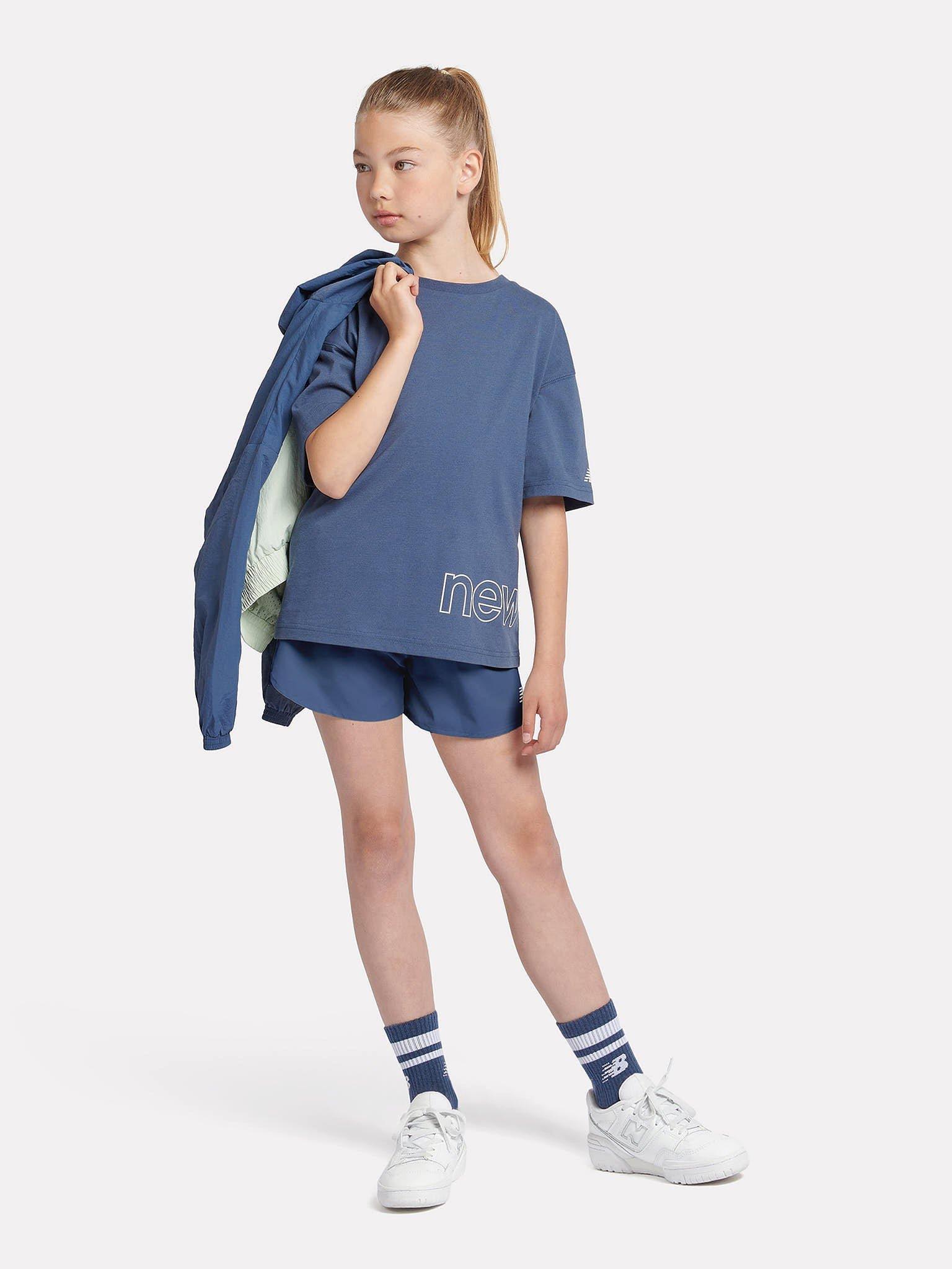 Product image 5 of 9, which shows New Balance Kids' Athletics Woven Shorts, Vintage Indigo, 7-8 years