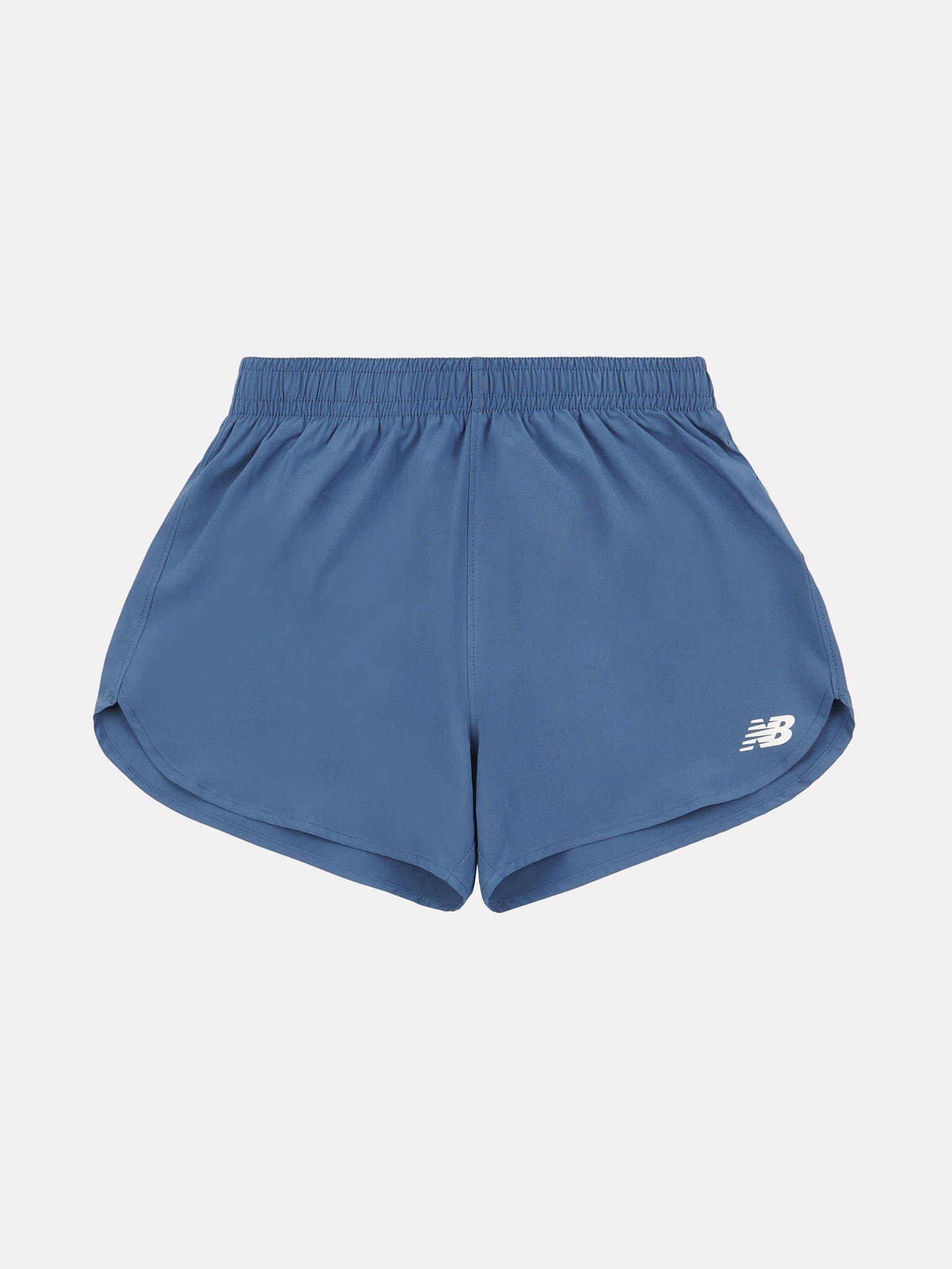 Product image 6 of 9, which shows New Balance Kids' Athletics Woven Shorts, Vintage Indigo, 7-8 years