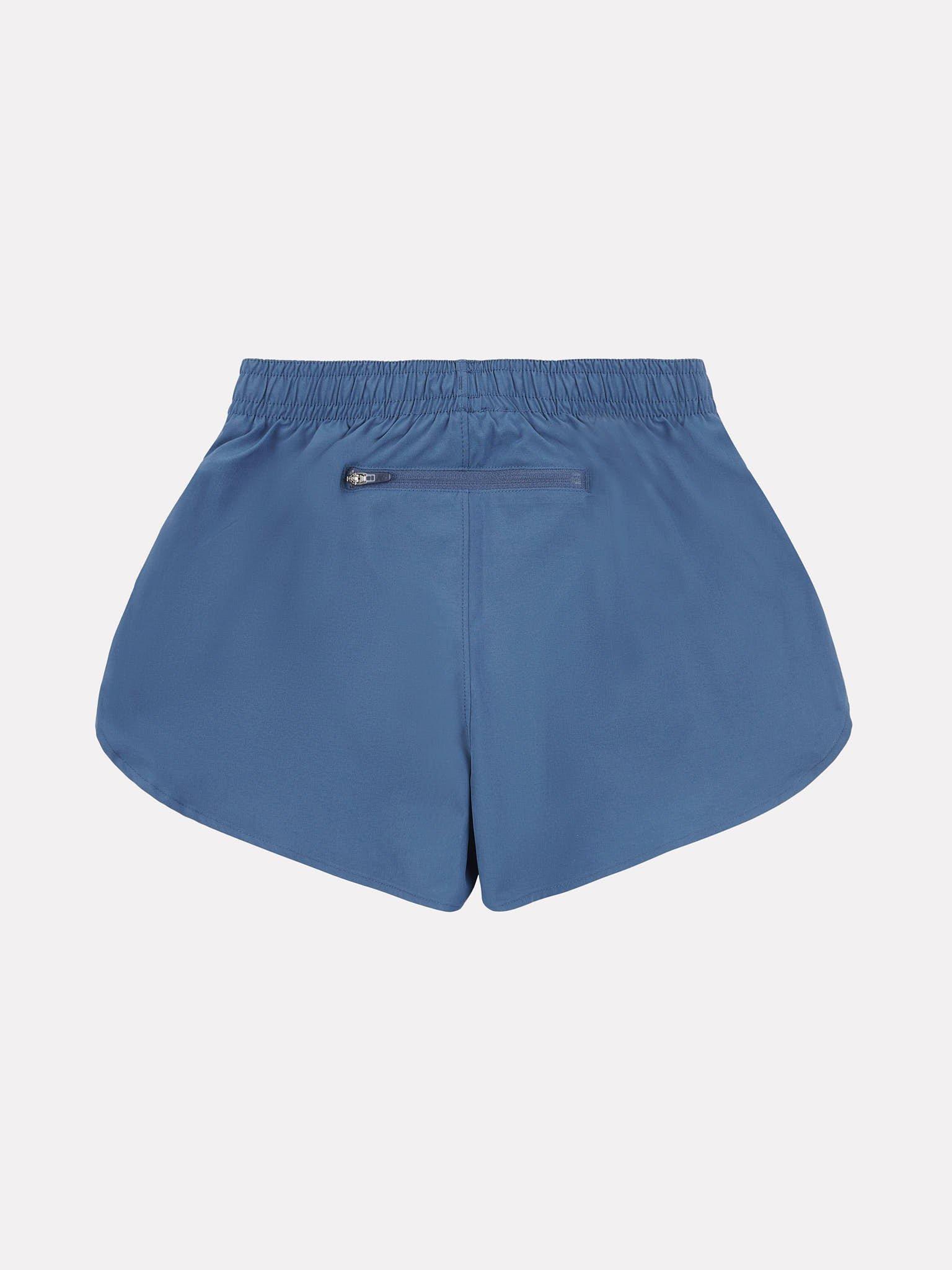 Product image 7 of 9, which shows New Balance Kids' Athletics Woven Shorts, Vintage Indigo, 7-8 years