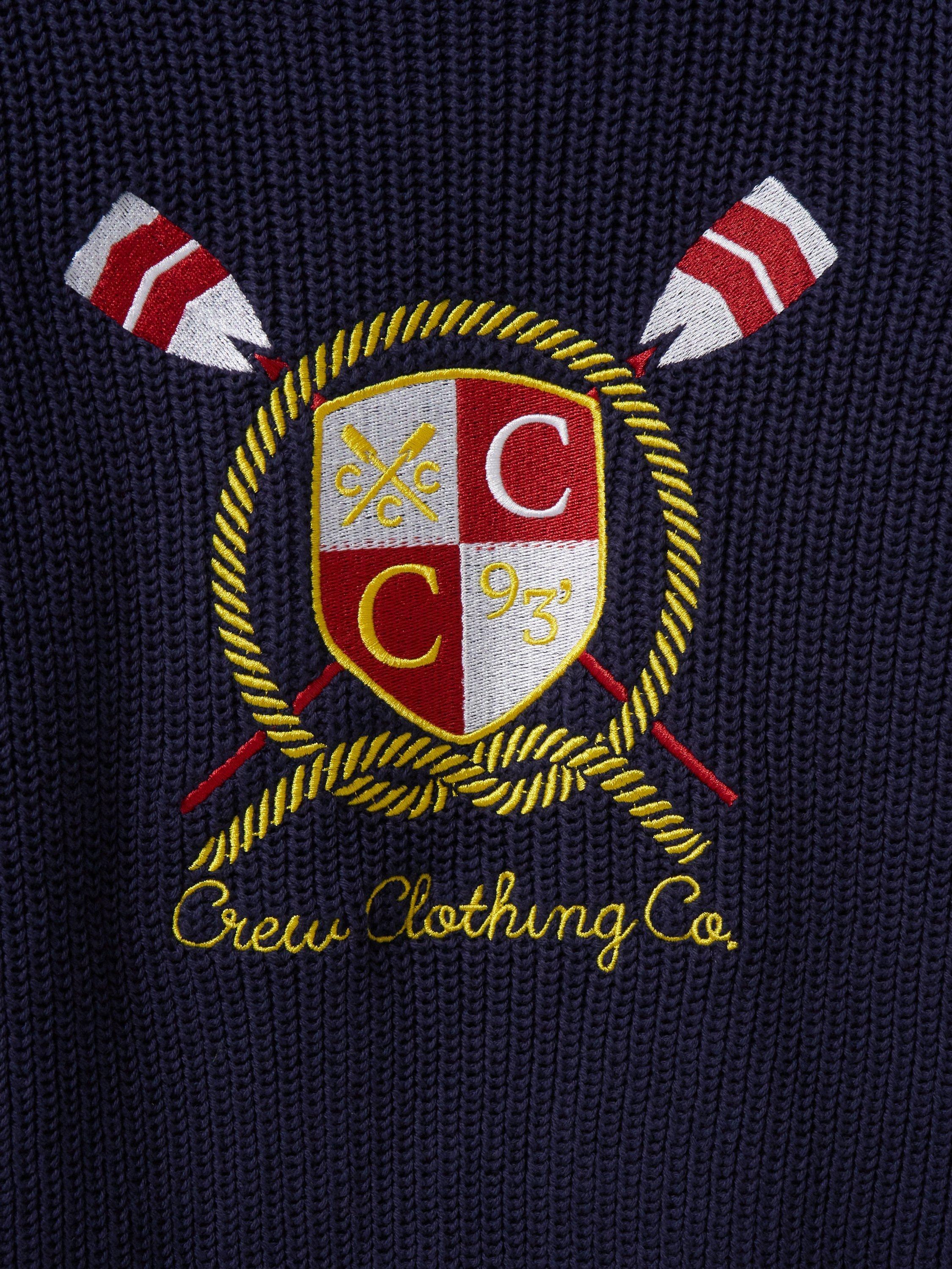 Product image 2 of 3, which shows Crew Clothing Kids' Embroidered Crest Logo Jumper, Navy/Multi, 8-9 years