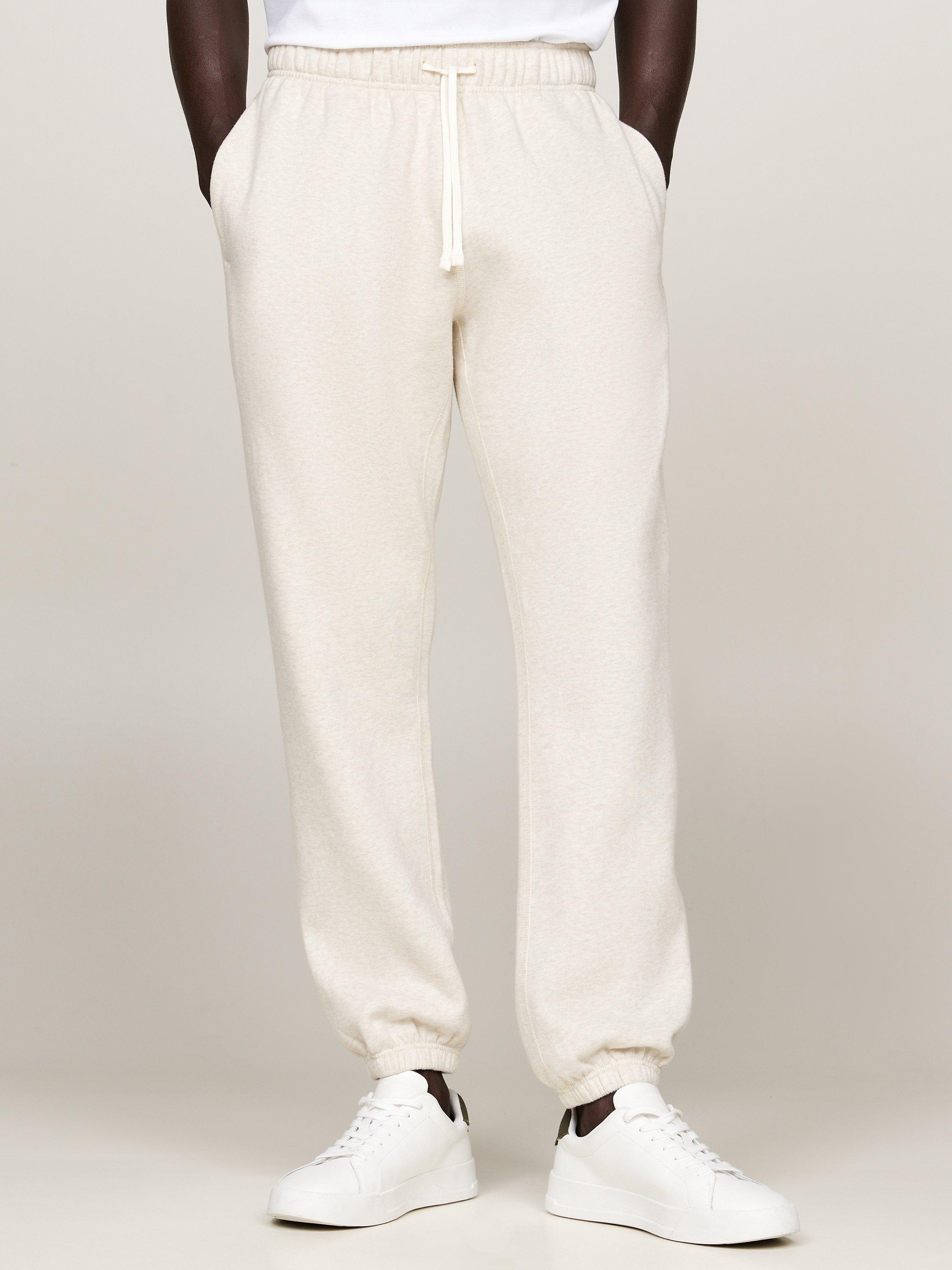 Product image 1 of 6, which shows Tommy Hilfiger Essential Fleece Joggers, Heathered Oatmilk, XS